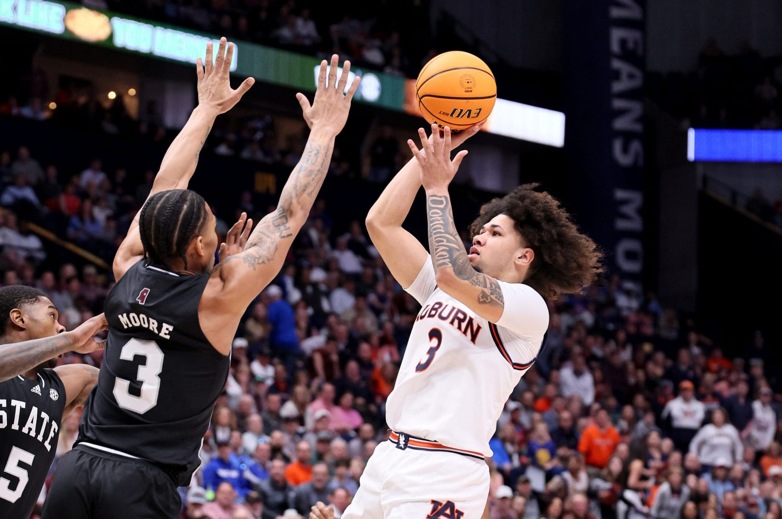 NASHVILLE, TENNESSEE - MARCH 16: Tre Donaldson #3 of the Auburn Tigers shoots the ball while defended by Shakeel Moore #3 of the Mississippi State Bulldogs at Bridgestone Arena on March 16, 2024 in Nashville, Tennessee. (Photo by Andy Lyons/Getty Images) NASHVILLE, TENNESSEE - MARCH 16: Tre Donaldson #3 of the Auburn Tigers shoots the ball while defended by Shakeel Moore #3 of the Mississippi State Bulldogs at Bridgestone Arena on March 16, 2024 in Nashville, Tennessee. (Photo by Andy Lyons/Getty Images)