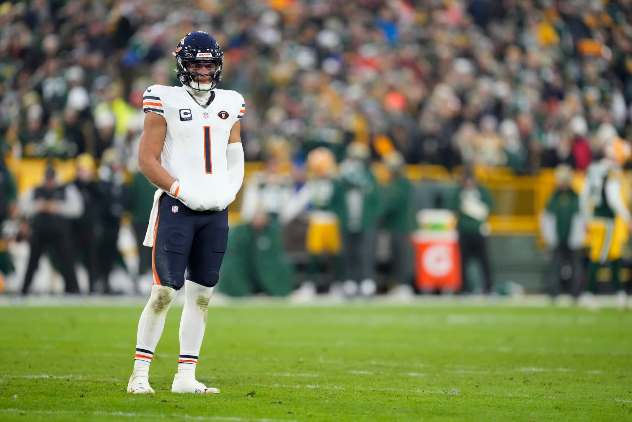 GREEN BAY, WISCONSIN - JANUARY 07: Justin Fields #1 of the Chicago Bears looks on in the first half against the Green Bay Packers at Lambeau Field on January 07, 2024 in Green Bay, Wisconsin. (Photo by Patrick McDermott/Getty Images)