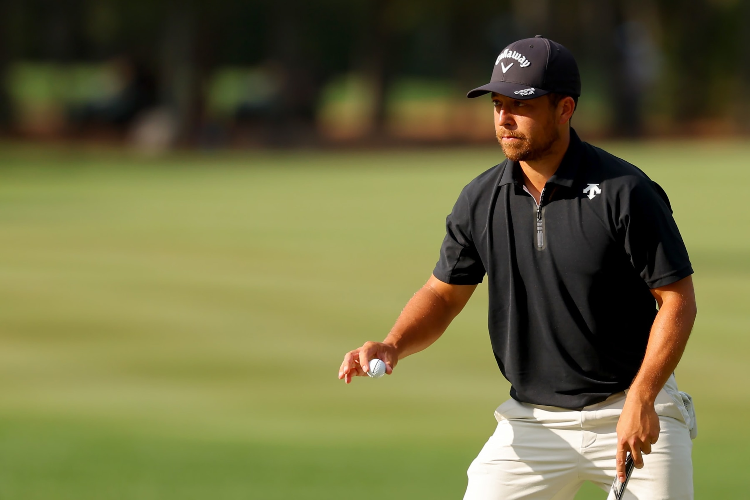 PONTE VEDRA BEACH, FLORIDA - MARCH 16: Xander Schauffele of the United States reacts after making birdie on the 11th green during the third round of THE PLAYERS Championship at TPC Sawgrass on March 16, 2024 in Ponte Vedra Beach, Florida. (Photo by Kevin C. Cox/Getty Images)