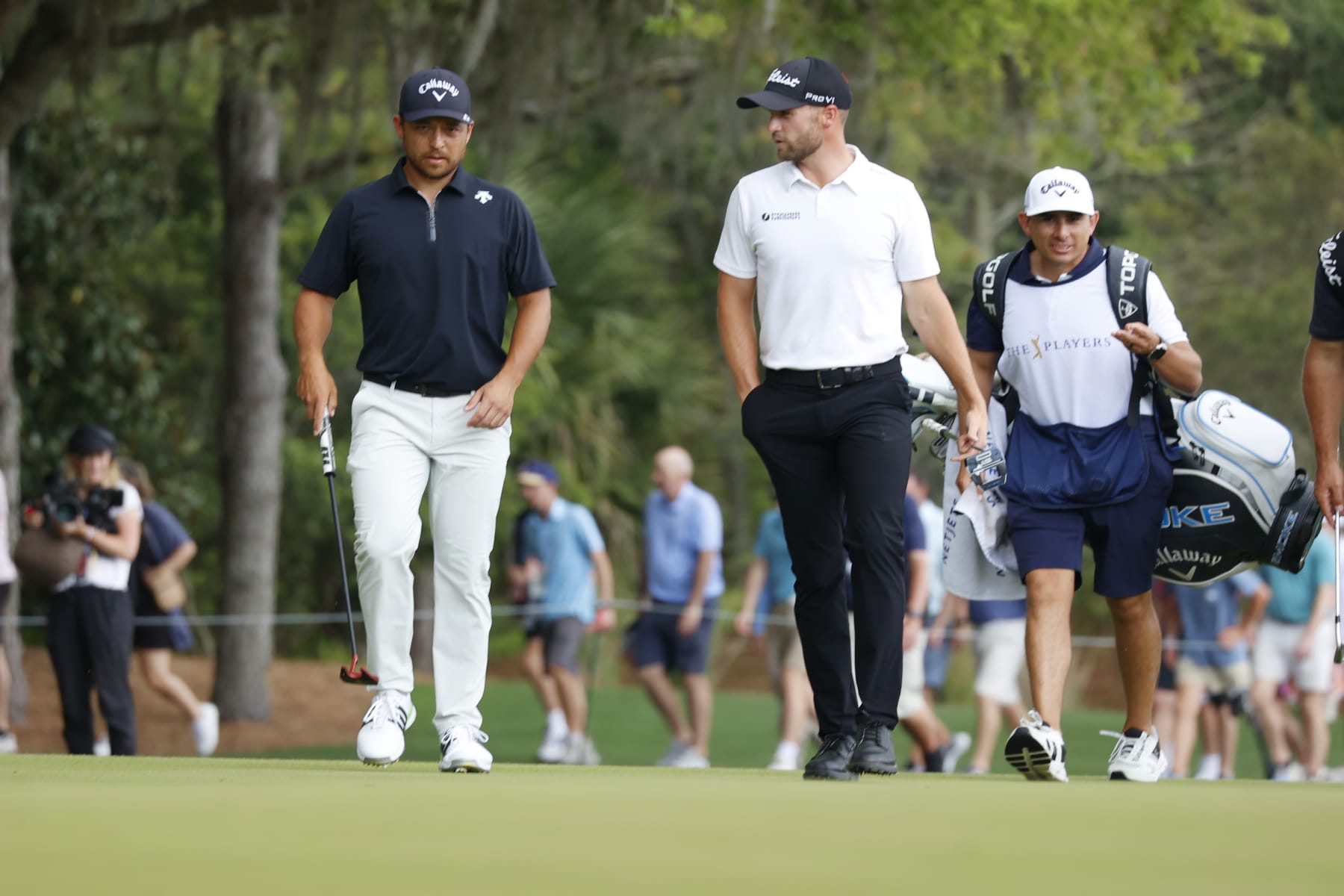 PONTE VEDRA BEACH, FL - MARCH 16: PGA golfers Xander Schauffele and Wyndham Clark walk the 3rd hole during the third round of The Players Championship on March 16, 2024, at TPC Sawgrass in Ponte Vedra Beach, Florida. (Photo by Brian Spurlock/Icon Sportswire via Getty Images)