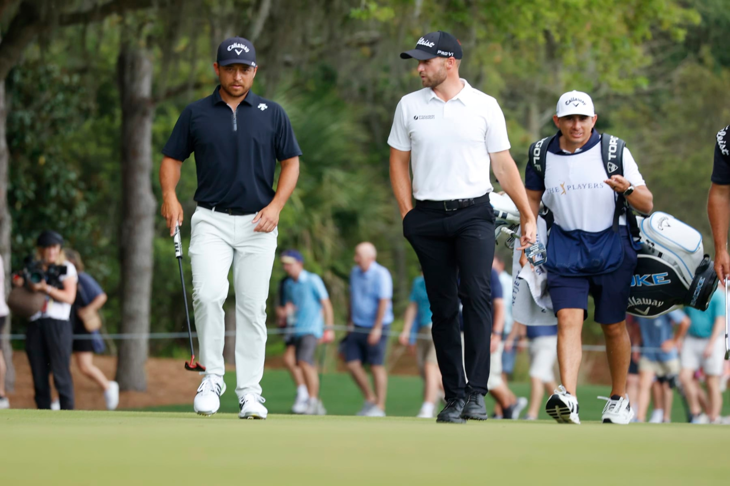 PONTE VEDRA BEACH, FL - MARCH 16: PGA golfers Xander Schauffele and Wyndham Clark walk the 3rd hole during the third round of The Players Championship on March 16, 2024, at TPC Sawgrass in Ponte Vedra Beach, Florida. (Photo by Brian Spurlock/Icon Sportswire via Getty Images)