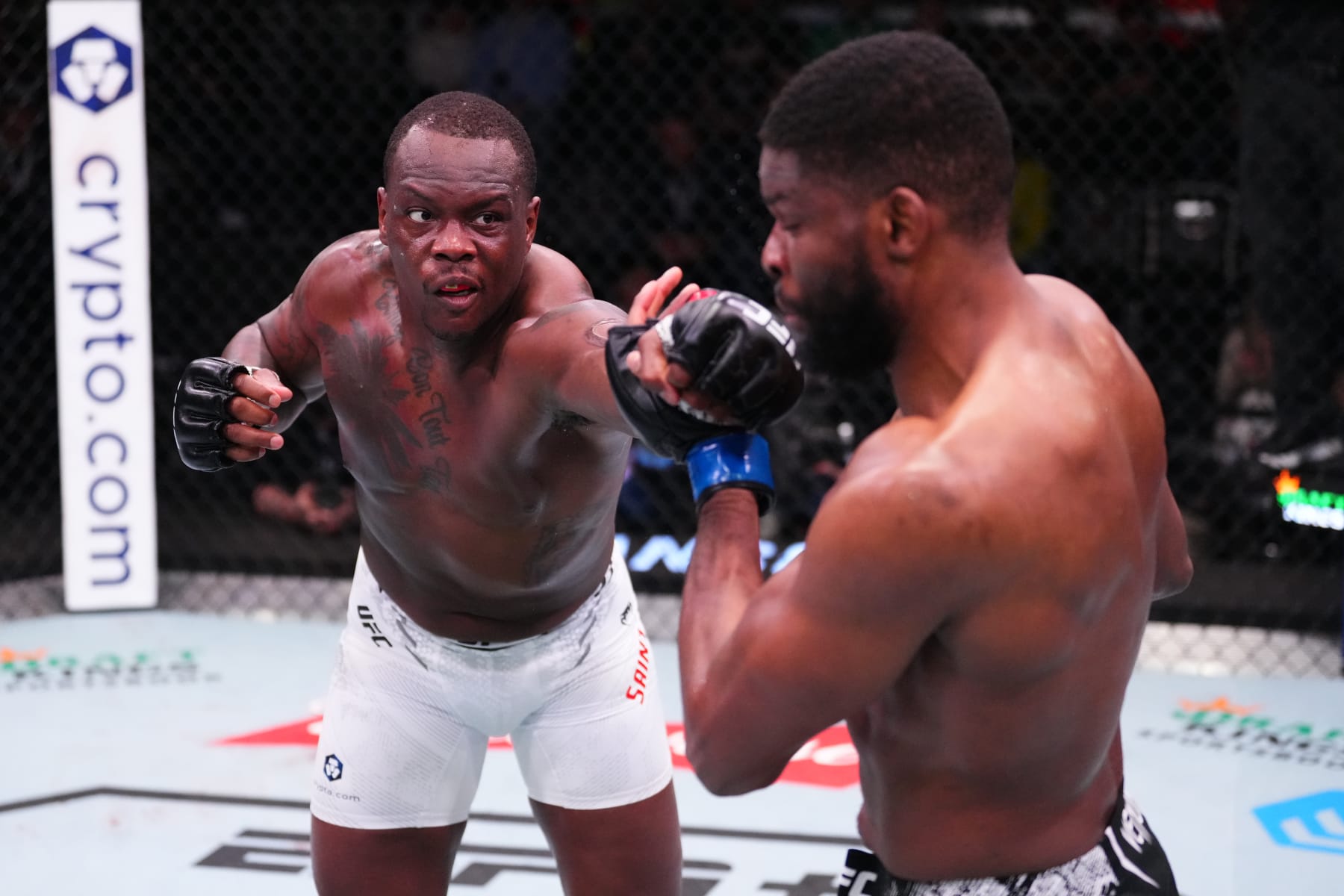 LAS VEGAS, NEVADA - MARCH 16: (L-R) Ovince Saint Preux punches Kennedy Nzechukwu of Nigeria in their light heavyweight fight during the UFC Fight Night event at UFC APEX on March 16, 2024 in Las Vegas, Nevada. (Photo by Jeff Bottari/Zuffa LLC via Getty Images)