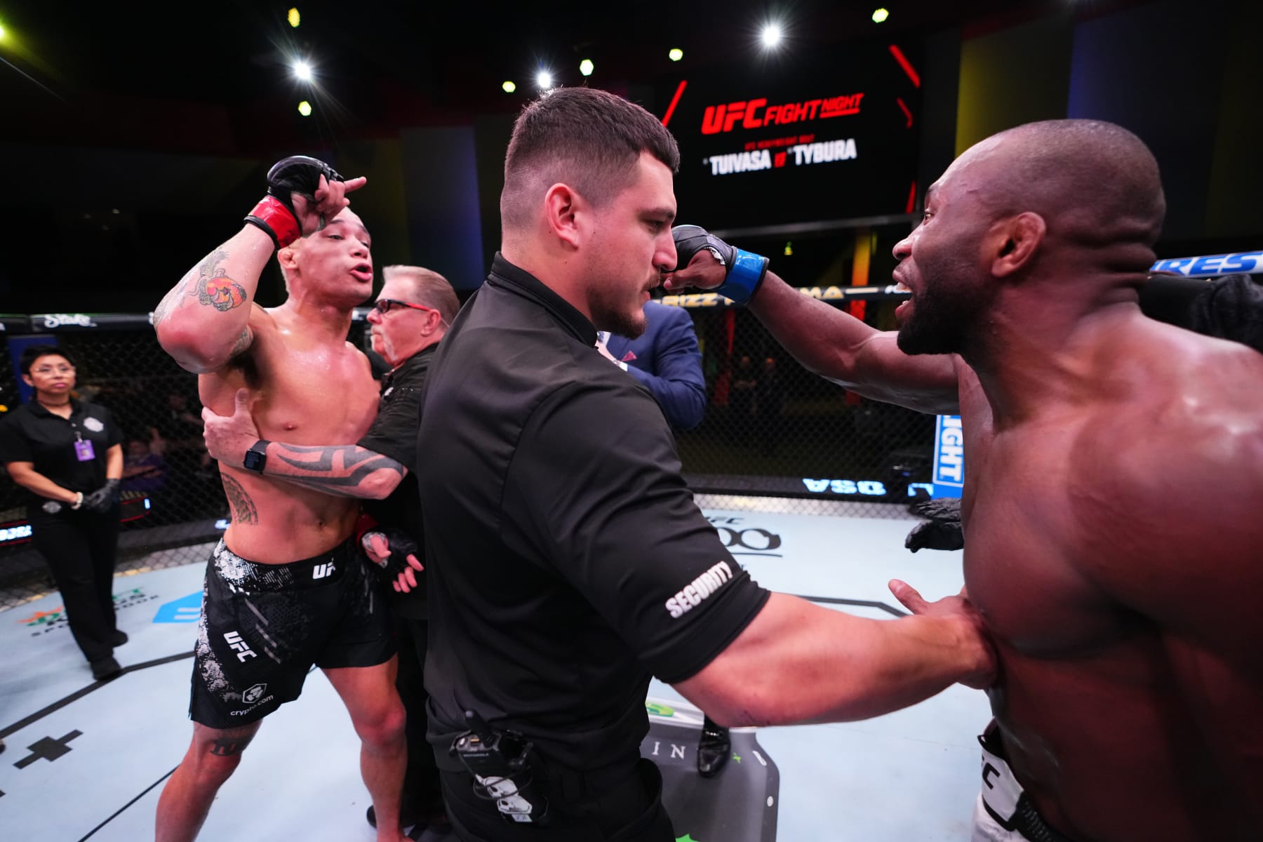 LAS VEGAS, NEVADA - MARCH 16: (L-R) Bryan Battle and Ange Loosa of the Congo react after a doctor stoppage due to an accidental eye poke in their welterweight fight during the UFC Fight Night event at UFC APEX on March 16, 2024 in Las Vegas, Nevada. (Photo by Jeff Bottari/Zuffa LLC via Getty Images)