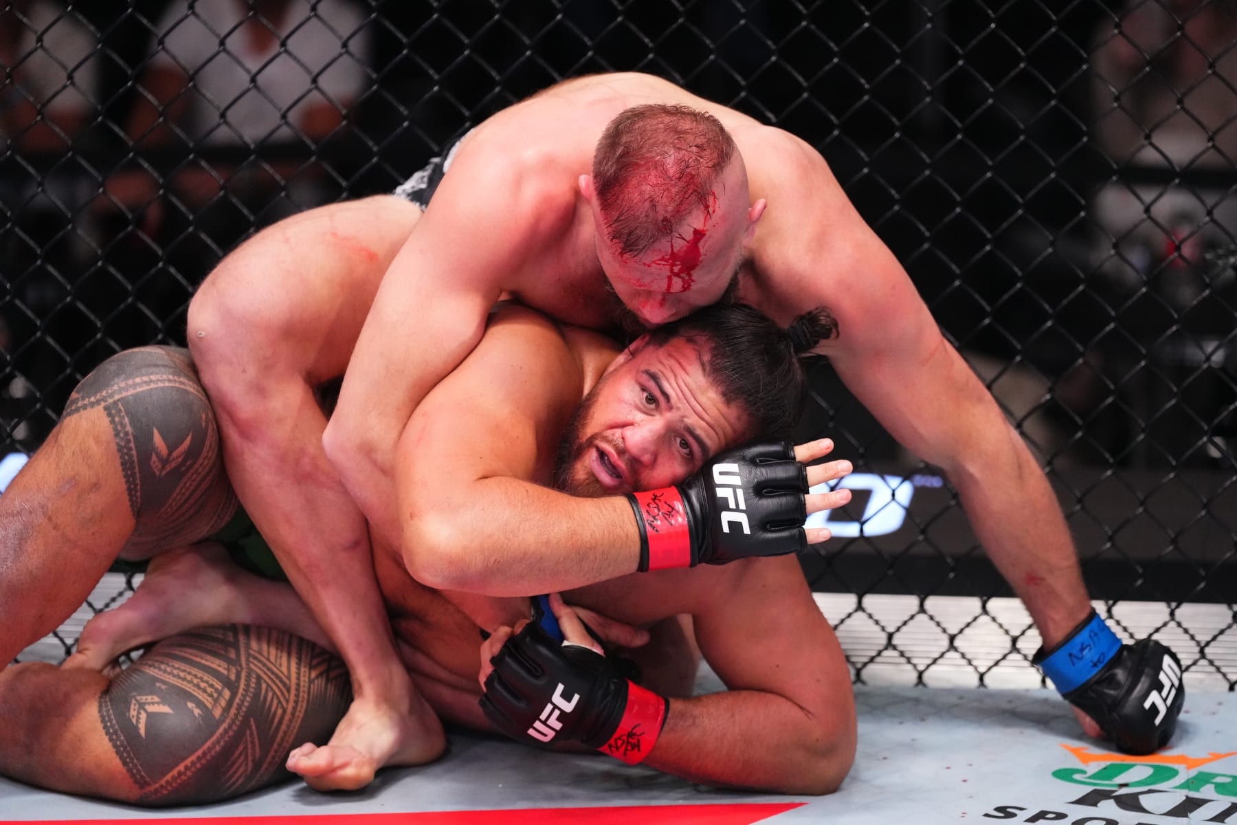 LAS VEGAS, NEVADA - MARCH 16: Marcin Tybura of Poland (top) attempts to submit Tai Tuivasa of Australia in their heavyweight fight during the UFC Fight Night event at UFC APEX on March 16, 2024 in Las Vegas, Nevada. (Photo by Jeff Bottari/Zuffa LLC via Getty Images)