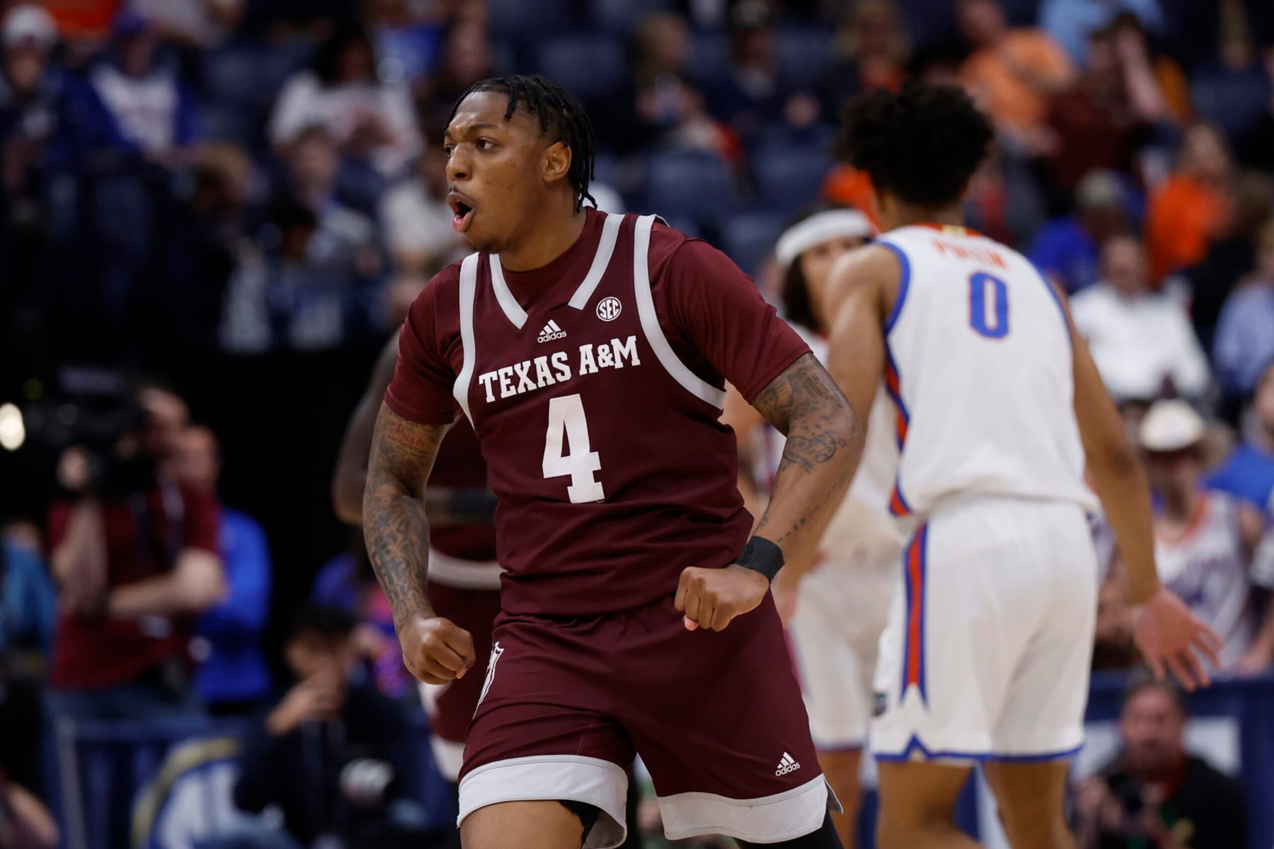NASHVILLE, TN - MARCH 16: Texas A&M Aggies guard Wade Taylor IV (4) flexes after hitting a 3-pointer during a semifinal round game of the men's Southeastern Conference Tournament between the Florida Gators and Texas A&M Aggies March 16, 2024, at Bridgestone Arena in Nashville, Tennessee.