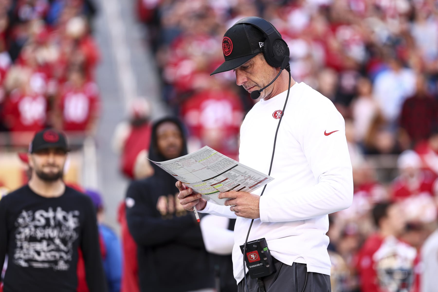 SANTA CLARA, CA - JANUARY 28: Head coach Kyle Shanahan of the San Francisco 49ers reads his play sheet prior to the NFC Championship NFL football game against the Detroit Lions at Levi's Stadium on January 28, 2024 in Santa Clara, California. (Photo by Kevin Sabitus/Getty Images)