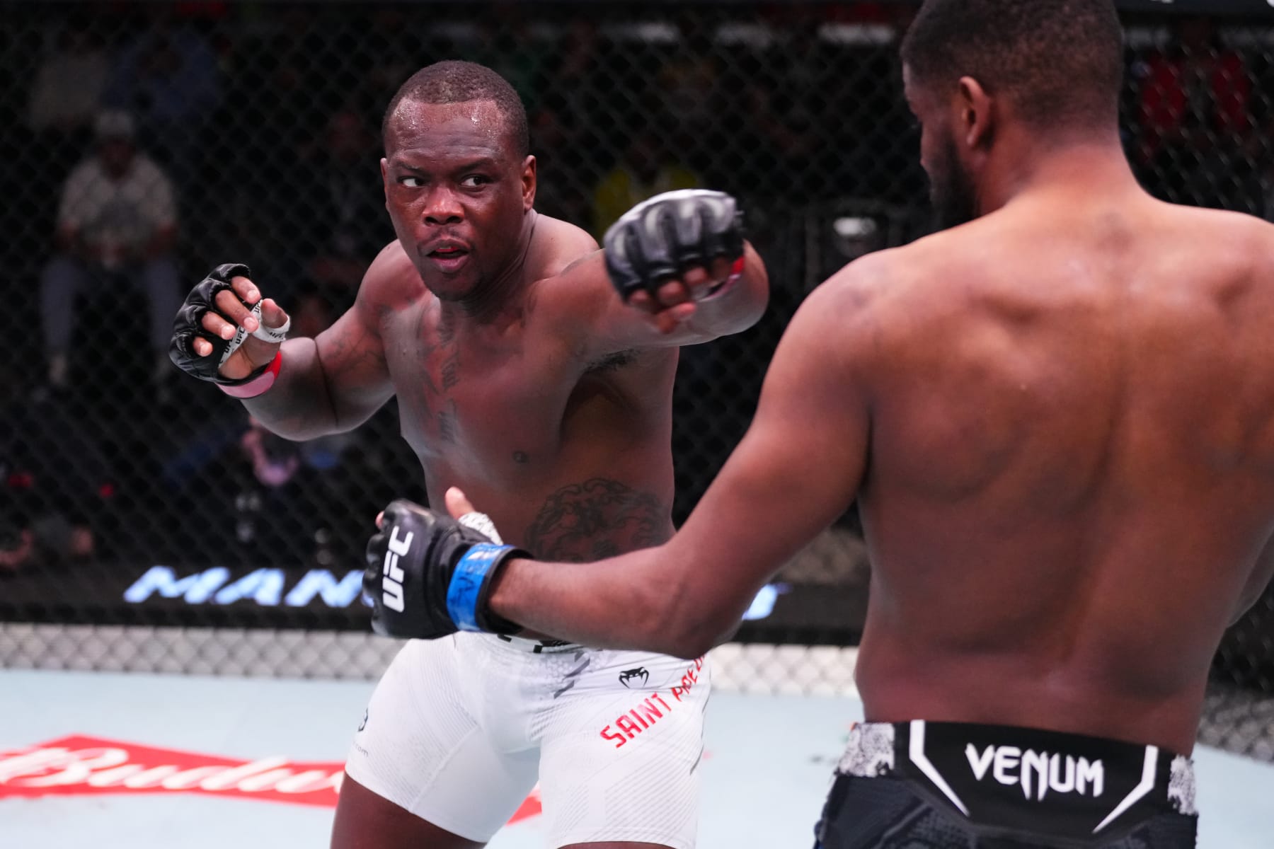 Ovince Saint Preux throws a punch at Kennedy Nzechukwu