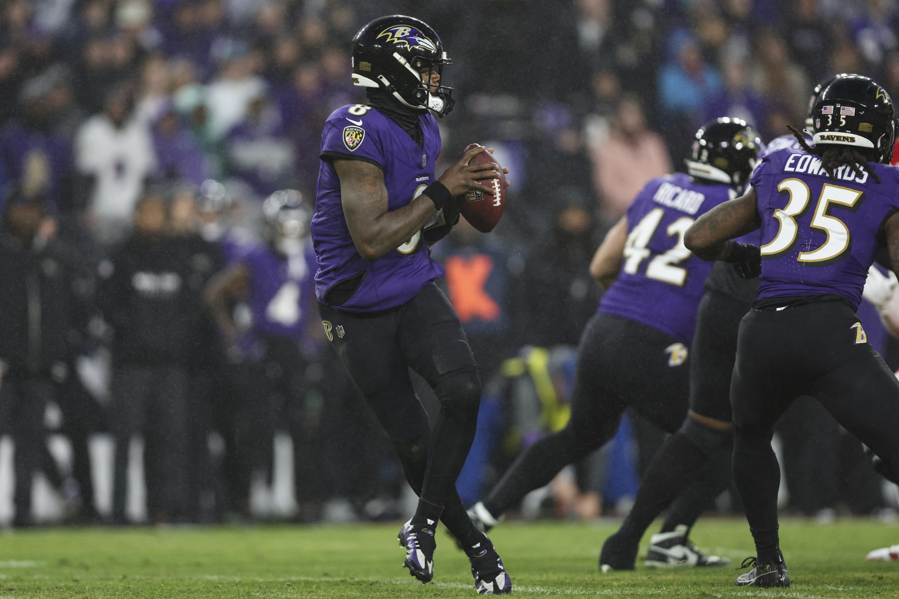 BALTIMORE, MD - JANUARY 28: Lamar Jackson #8 of the Baltimore Ravens drops back to pass during the AFC Championship NFL football game against the Kansas City Chiefs at M&T Bank Stadium on January 28, 2024 in Baltimore, Maryland. (Photo by Perry Knotts/Getty Images)