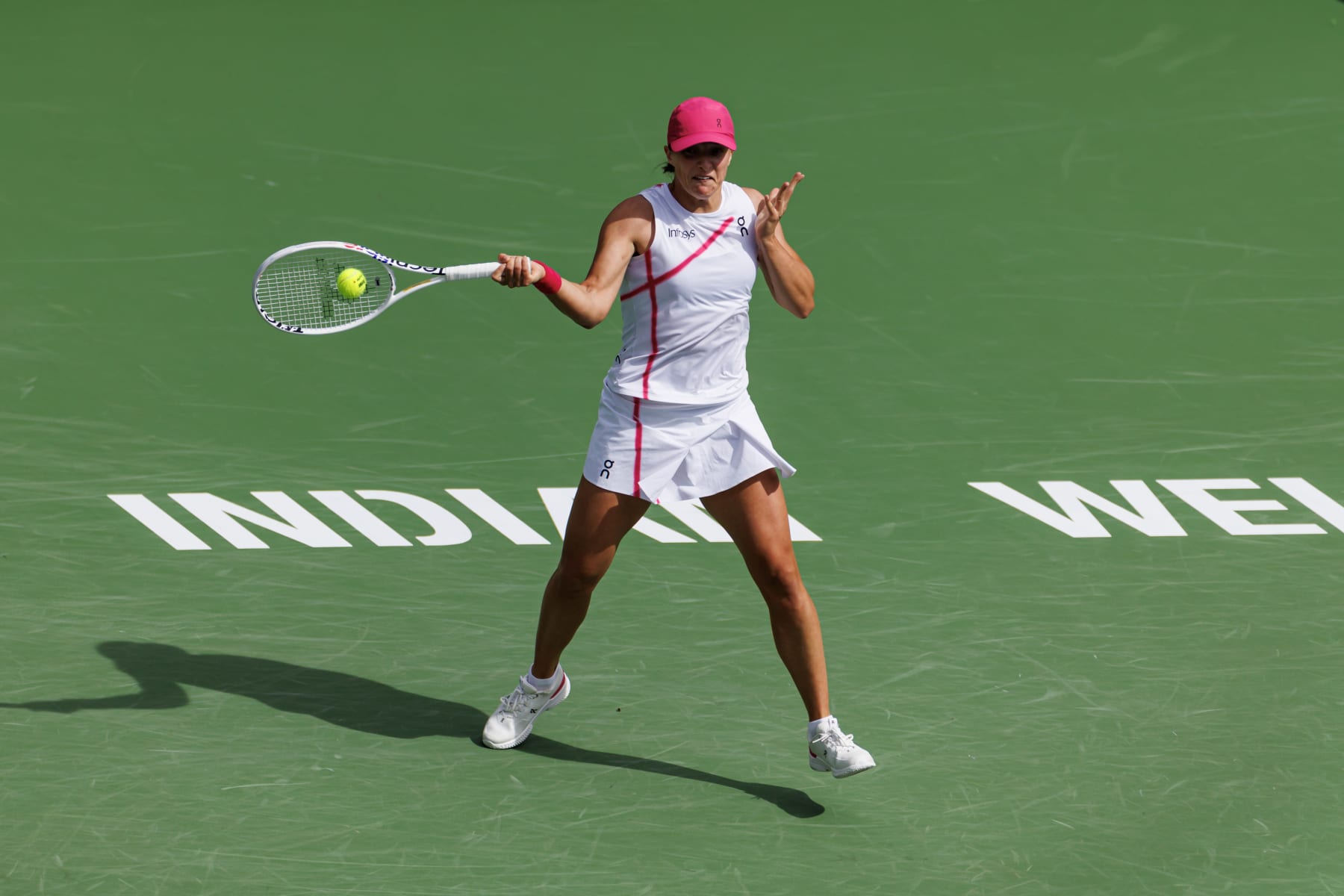 INDIAN WELLS, CALIFORNIA - MARCH 17: Iga Swiatek of Poland hits a forehand against Maria Sakkari of Greece in the final of the BNP Paribas Open at Indian Wells Tennis Garden on March 17, 2024 in Indian Wells, California. (Photo by Frey/TPN/Getty Images)