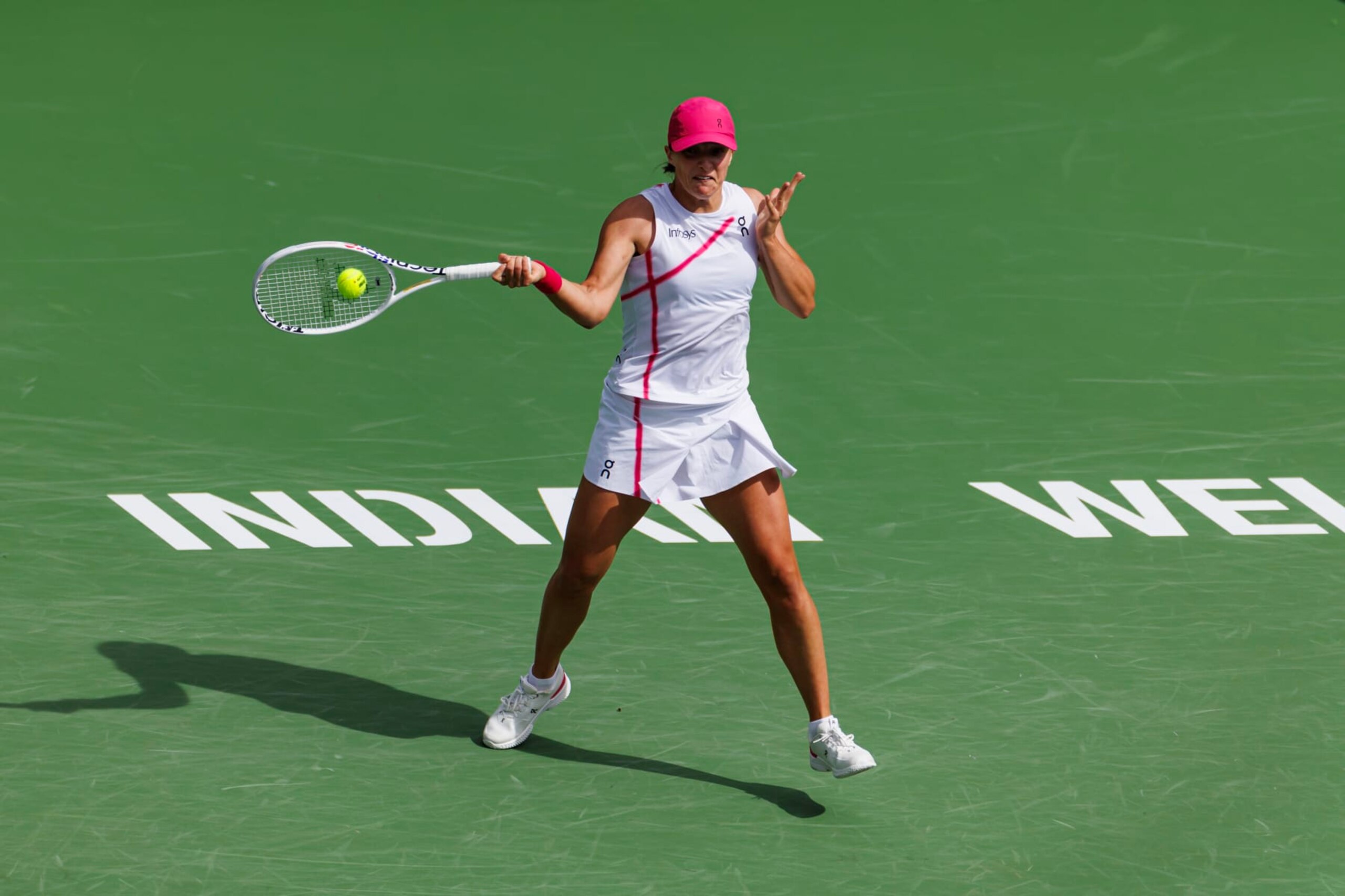 INDIAN WELLS, CALIFORNIA - MARCH 17: Iga Swiatek of Poland hits a forehand against Maria Sakkari of Greece in the final of the BNP Paribas Open at Indian Wells Tennis Garden on March 17, 2024 in Indian Wells, California. (Photo by Frey/TPN/Getty Images)