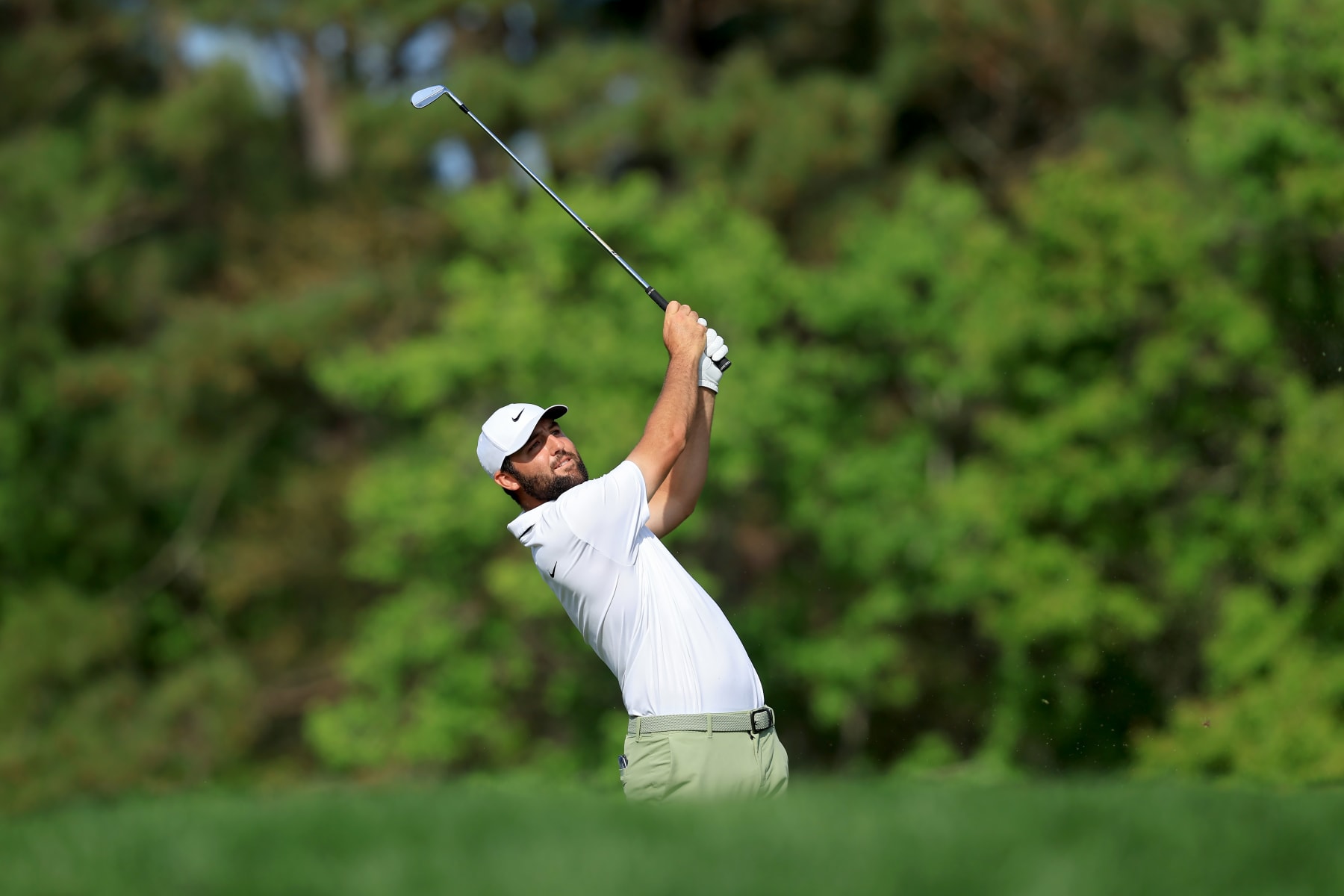 PONTE VEDRA BEACH, FLORIDA - MARCH 17: Scottie Scheffler of the United States plays a shot on the 14th hole during the final round of THE PLAYERS Championship at TPC Sawgrass on March 17, 2024 in Ponte Vedra Beach, Florida. (Photo by Sam Greenwood/Getty Images)