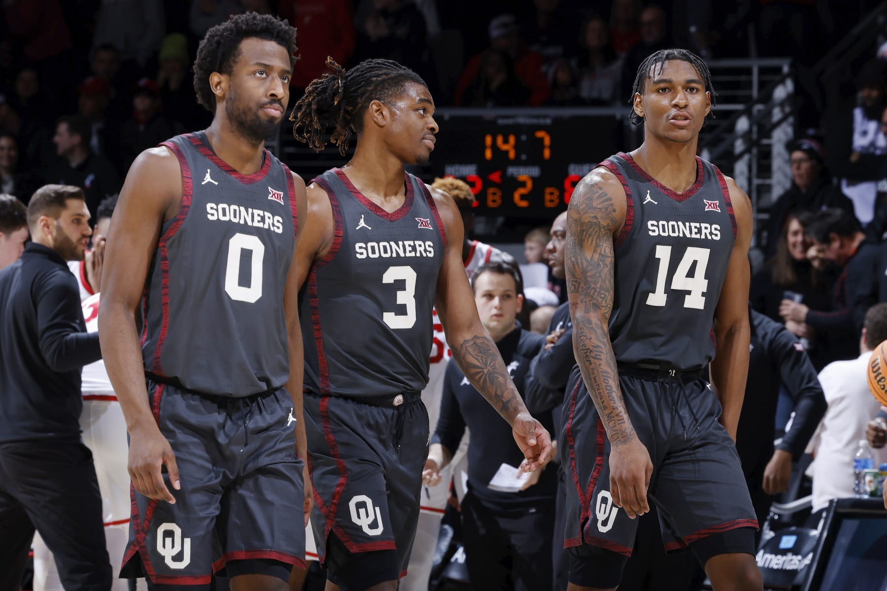 CINCINNATI, OH - JANUARY 20: Oklahoma Sooners forward Jalon Moore (14), guard Otega Oweh (3) and guard Le'Tre Darthard (0) look on during a college basketball game against the Cincinnati Bearcats on January 20, 2024 at Fifth Third Arena in Cincinnati, Ohio. (Photo by Joe Robbins/Icon Sportswire via Getty Images)