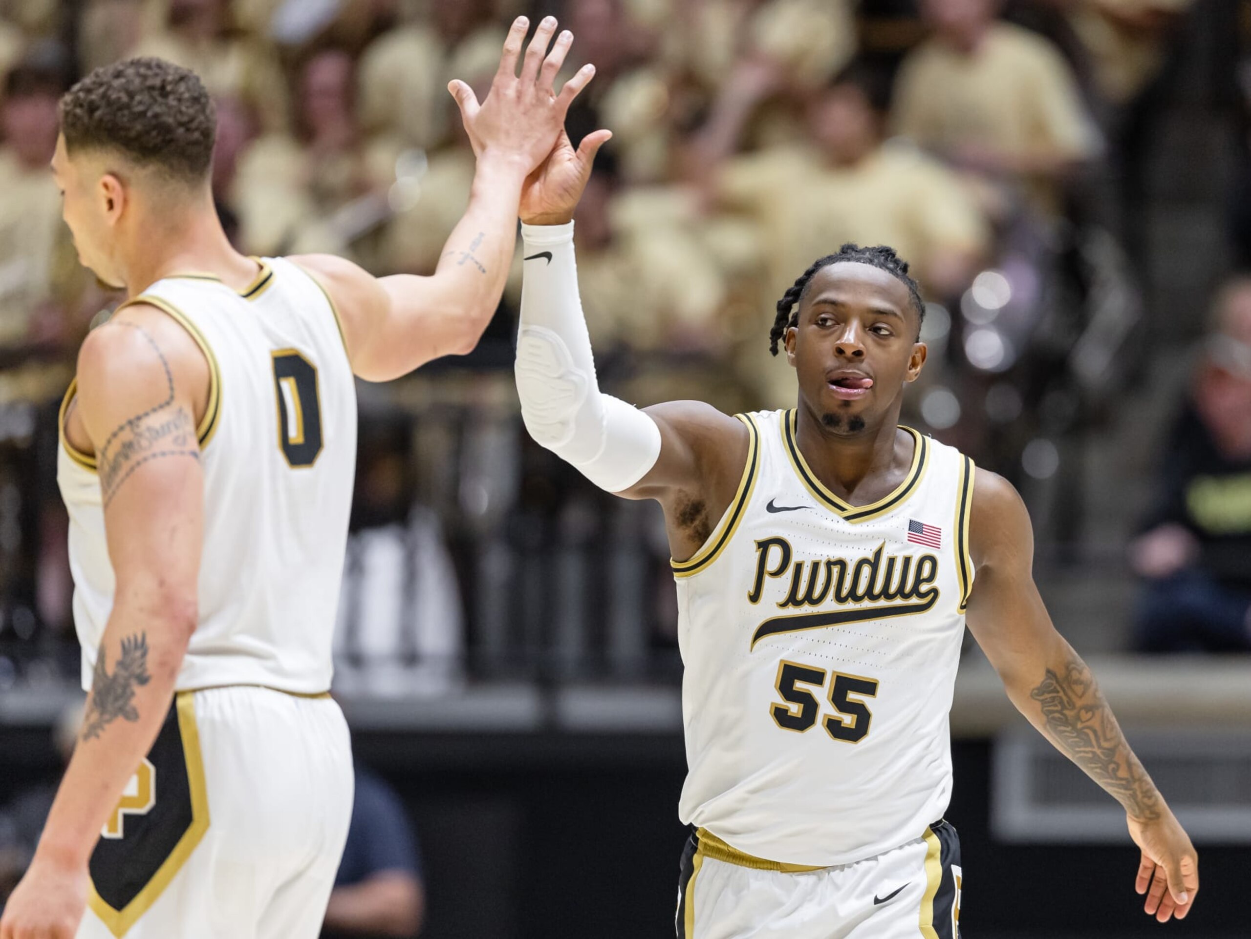 WEST LAFAYETTE, INDIANA - MARCH 10: Mason Gillis #0 and Lance Jones #55 of the Purdue Boilermakers high five during the game against the Wisconsin Badgers at Mackey Arena on March 10, 2024 in West Lafayette, Indiana. (Photo by Michael Hickey/Getty Images)