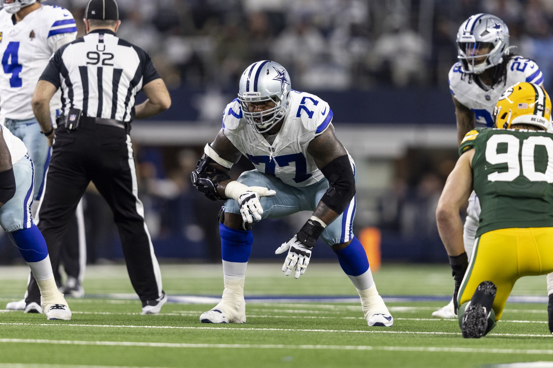 ARLINGTON, TEXAS - JANUARY 14: Tyron Smith #77 of the Dallas Cowboys lines up during an NFL wild-card playoff football game between the Dallas Cowboys and the Green Bay Packers at AT&T Stadium on January 14, 2024 in Arlington, Texas. (Photo by Michael Owens/Getty Images)