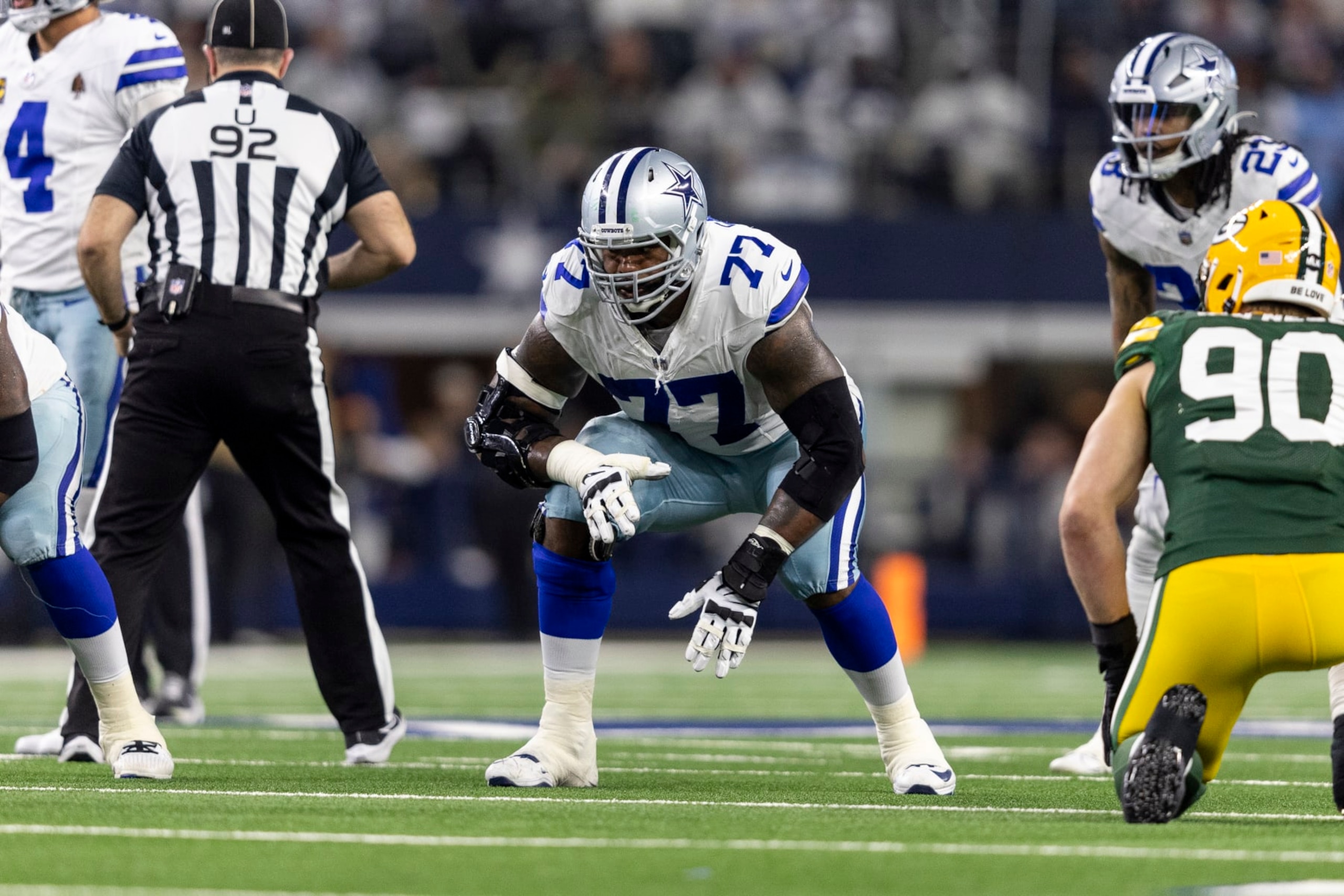 ARLINGTON, TEXAS - JANUARY 14: Tyron Smith #77 of the Dallas Cowboys lines up during an NFL wild-card playoff football game between the Dallas Cowboys and the Green Bay Packers at AT&T Stadium on January 14, 2024 in Arlington, Texas. (Photo by Michael Owens/Getty Images)