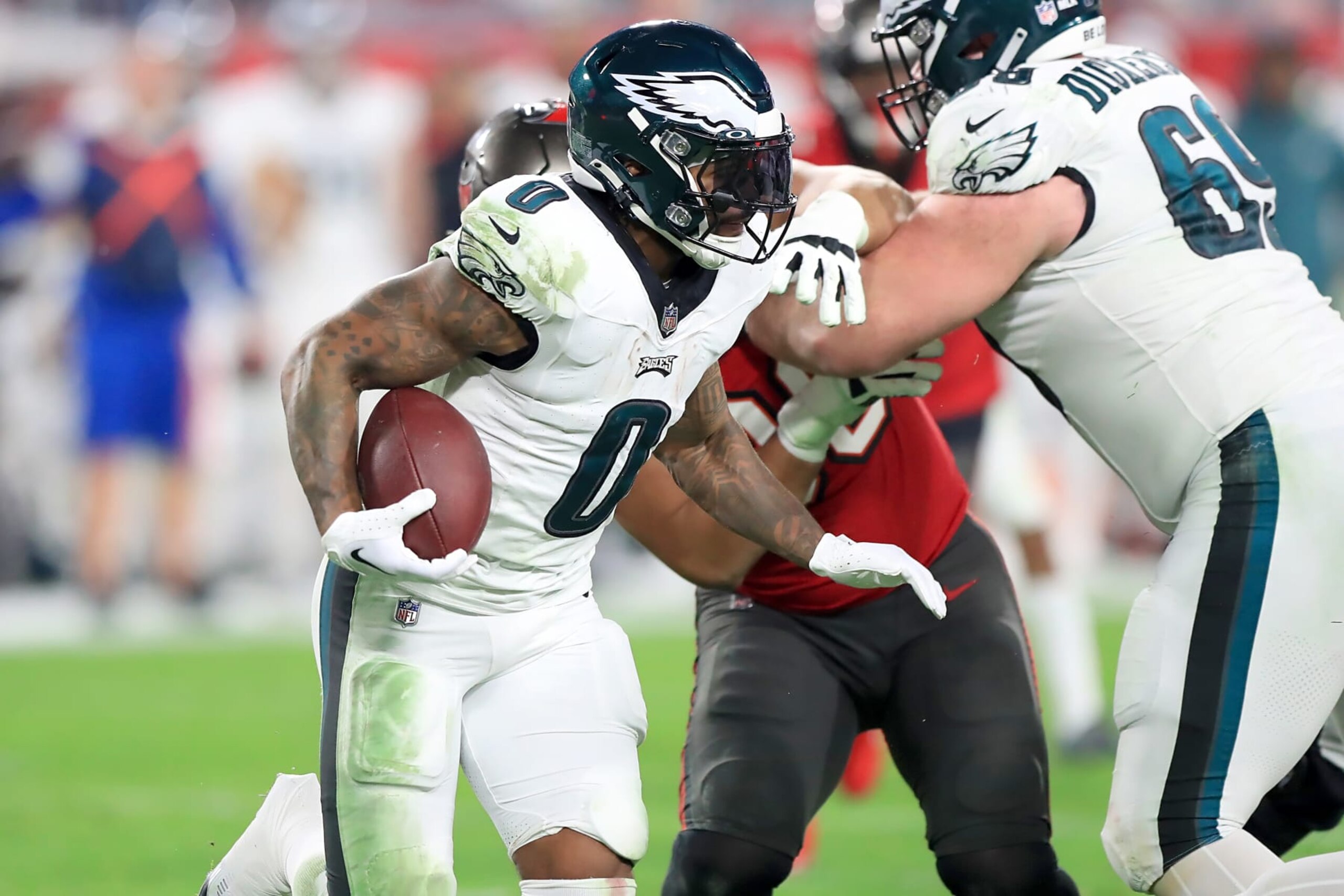 TAMPA, FL - JANUARY 15: Philadelphia Eagles Running Back D'Andre Swift (0) carries the ball during the NFC Wild Card game between the Philadelphia Eagles and the Tampa Bay Buccaneers on January 15, 2024 at Raymond James Stadium in Tampa, Florida. (Photo by Cliff Welch/Icon Sportswire via Getty Images) TAMPA, FL - JANUARY 15: Philadelphia Eagles Running Back D'Andre Swift (0) carries the ball during the NFC Wild Card game between the Philadelphia Eagles and the Tampa Bay Buccaneers on January 15, 2024 at Raymond James Stadium in Tampa, Florida. (Photo by Cliff Welch/Icon Sportswire via Getty Images)