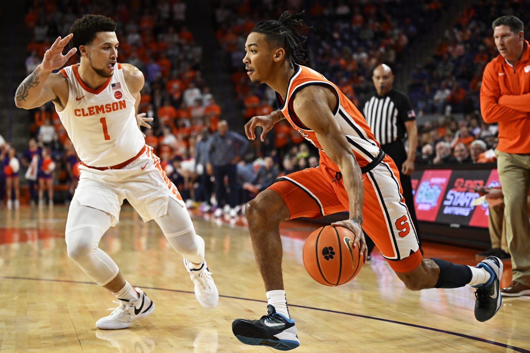 CLEMSON, SOUTH CAROLINA - MARCH 05: Judah Mintz #3 of the Syracuse Orange drives to the basket against Chase Hunter #1 of the Clemson Tigers in the first half at Littlejohn Coliseum on March 05, 2024 in Clemson, South Carolina. (Photo by Eakin Howard/Getty Images)