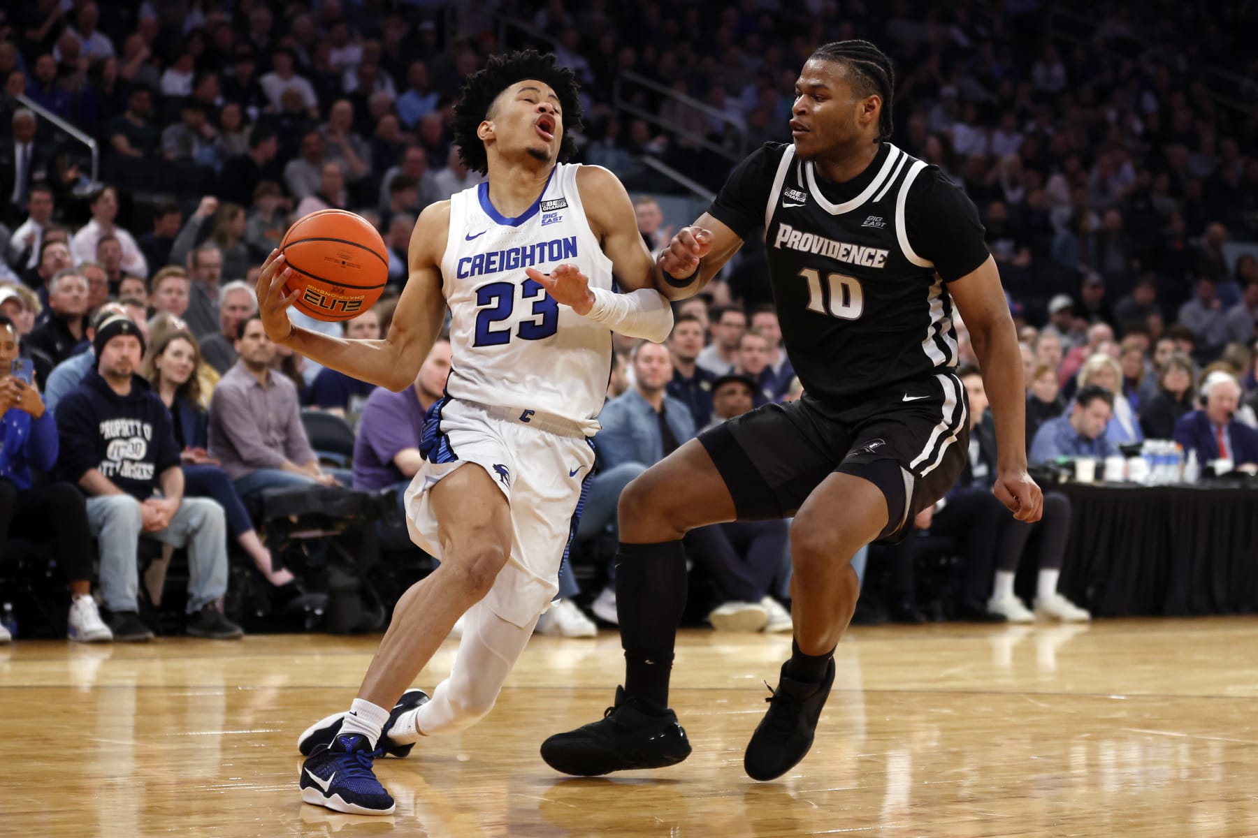 NEW YORK, NEW YORK - MARCH 14: Trey Alexander #23 of the Creighton Bluejays dribbles against Rich Barron #10 of the Providence Friars in the second half during the Quarterfinals of the Big East Basketball Tournament at Madison Square Garden on March 14, 2024 in New York City. The Friars won 78-73. (Photo by Sarah Stier/Getty Images)