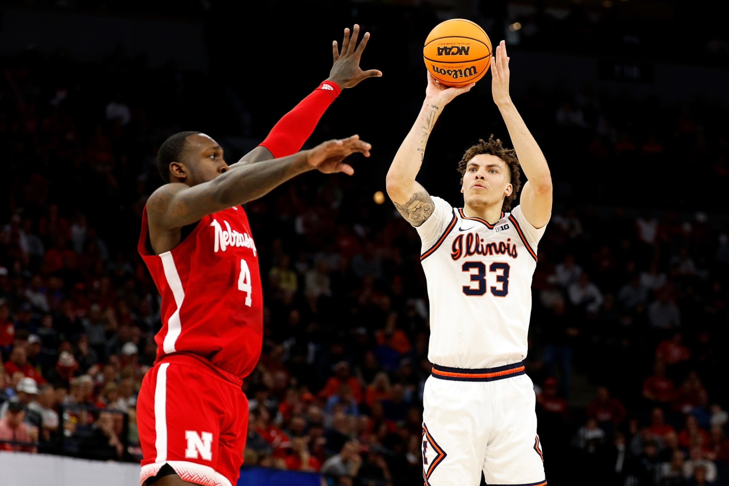 MINNEAPOLIS, MINNESOTA - MARCH 16: Coleman Hawkins #33 of the Illinois Fighting Illini shoots the ball against Juwan Gary #4 of the Nebraska Cornhuskers in the first half at Target Center in the Semifinals of the Big Ten Tournament on March 16, 2024 in Minneapolis, Minnesota. (Photo by David Berding/Getty Images) MINNEAPOLIS, MINNESOTA - MARCH 16: Coleman Hawkins #33 of the Illinois Fighting Illini shoots the ball against Juwan Gary #4 of the Nebraska Cornhuskers in the first half at Target Center in the Semifinals of the Big Ten Tournament on March 16, 2024 in Minneapolis, Minnesota. (Photo by David Berding/Getty Images)