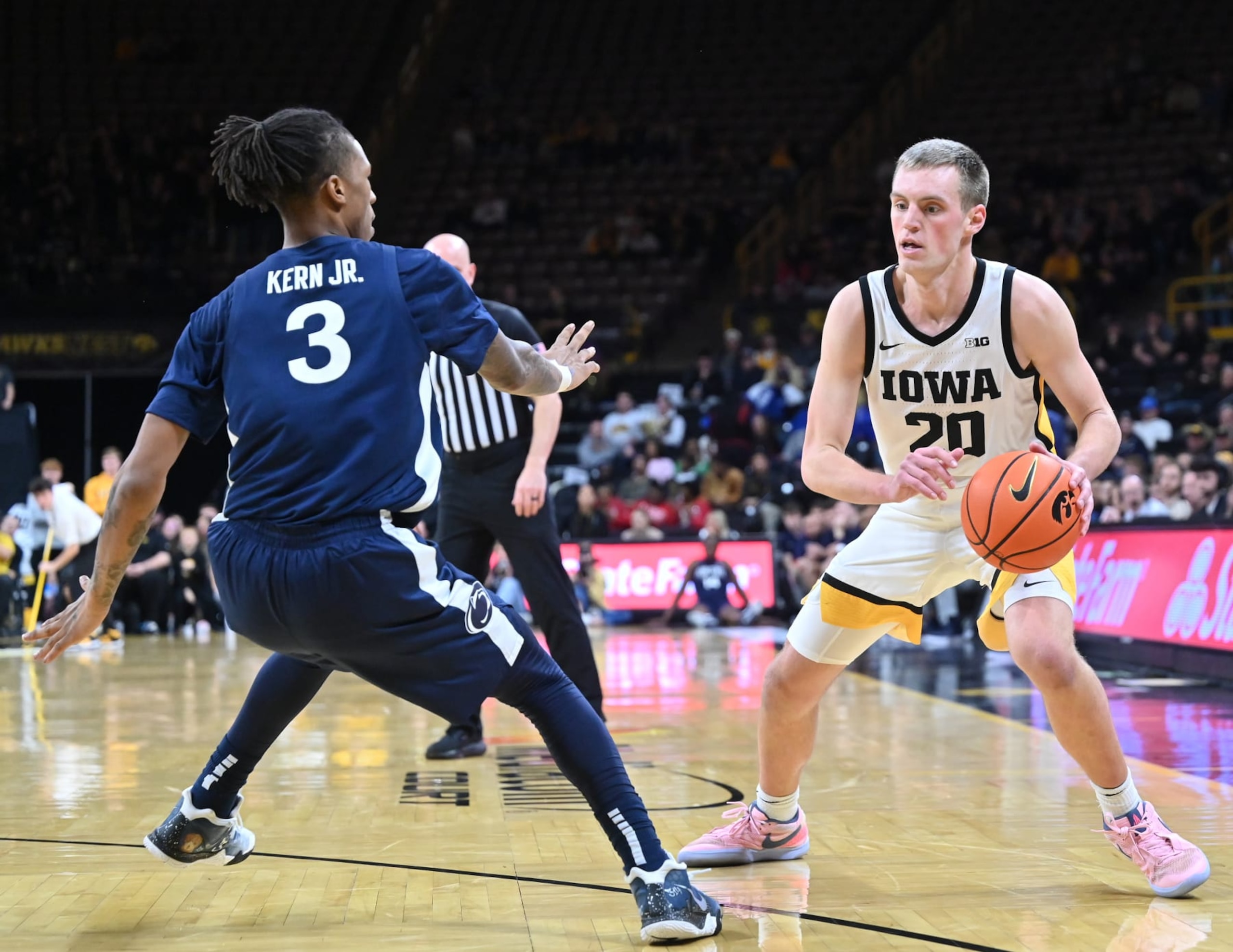 IOWA CITY, IA - FEBRUARY 27: Iowa forward Payton Sandfort (20) passes the ball as \ps23\ defends during a college basketball game between the Penn State Nittany Lions and the Iowa Hawkeyes on February 27, 2024, at Carver-Hawkeye Arena in Iowa City, IA. (Photo by Keith Gillett/Icon Sportswire via Getty Images) IOWA CITY, IA - FEBRUARY 27: Iowa forward Payton Sandfort (20) passes the ball as \ps23\ defends during a college basketball game between the Penn State Nittany Lions and the Iowa Hawkeyes on February 27, 2024, at Carver-Hawkeye Arena in Iowa City, IA. (Photo by Keith Gillett/Icon Sportswire via Getty Images)