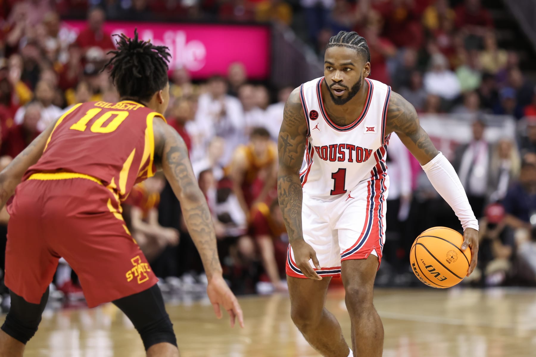 KANSAS CITY, MO - MARCH 16: Houston Cougars guard Jamal Shead (1) with the ball guarded by Iowa State Cyclones guard Keshon Gilbert (10) in the second half of the Big 12 tournament final between the Iowa State Cyclones and Houston Cougars on Mar 16, 2024 at T-Mobile Center in Kansas City, MO. (Photo by Scott Winters/Icon Sportswire via Getty Images)