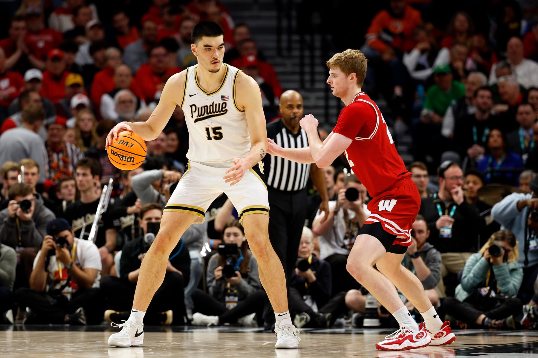 MINNEAPOLIS, MINNESOTA - MARCH 16: Zach Edey #15 of the Purdue Boilermakers dribbles the ball against Steven Crowl #22 of the Wisconsin Badgers in the second half at Target Center in the Semifinals of the Big Ten Tournament on March 16, 2024 in Minneapolis, Minnesota. The Badgers defeated the Boilermakers 76-75 in overtime. (Photo by David Berding/Getty Images)