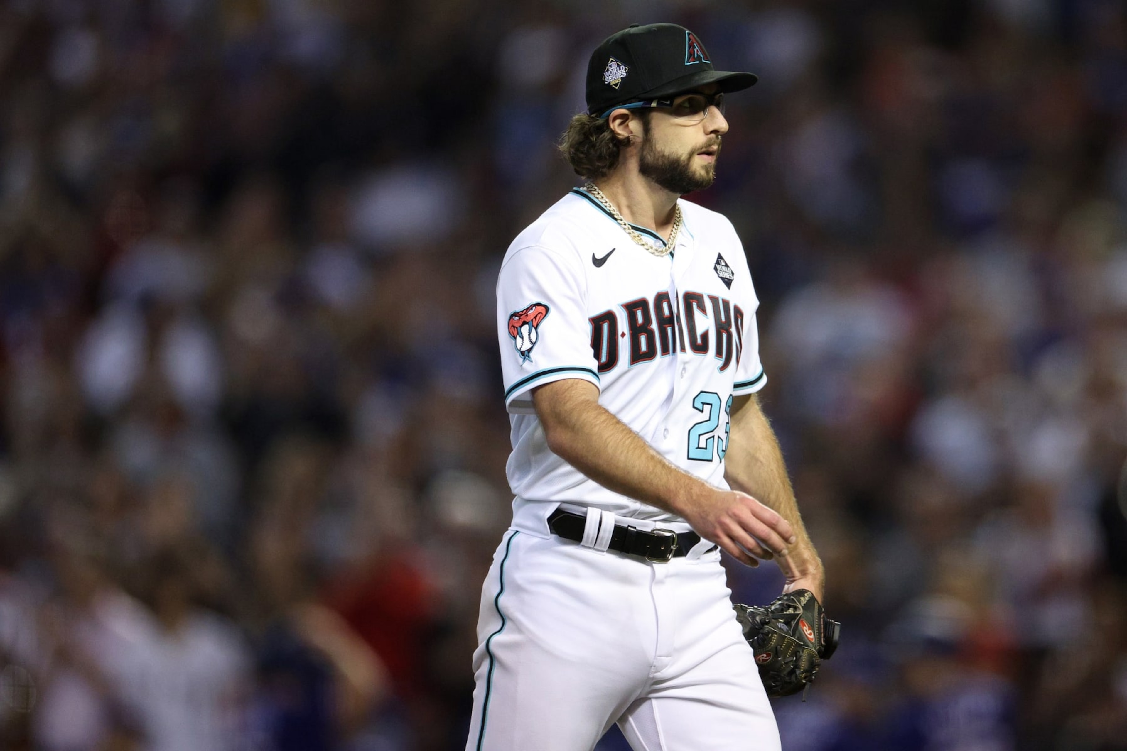 PHOENIX, ARIZONA - NOVEMBER 01: Zac Gallen #23 of the Arizona Diamondbacks walks off the field after being relieved in the seventh inning against the Texas Rangers during Game Five of the World Series at Chase Field on November 01, 2023 in Phoenix, Arizona. (Photo by Harry How/Getty Images)