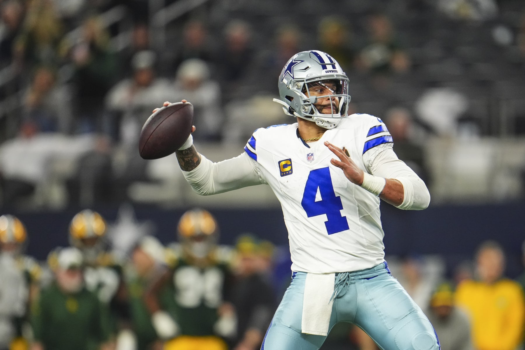 DALLAS, TX - JANUARY 14: Dak Prescott #4 of the Dallas Cowboys throws the ball during an NFL wild-card playoff football game against the Green Bay Packers at AT&T Stadium on January 14, 2024 in Dallas, Texas. (Photo by Cooper Neill/Getty Images)