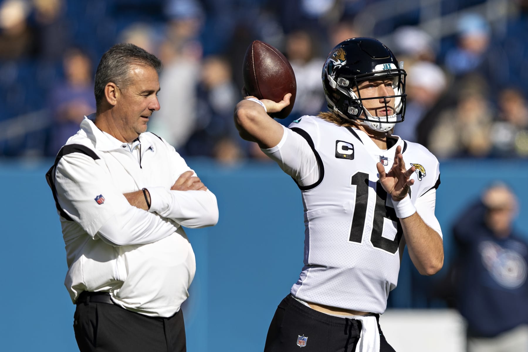 NASHVILLE, TENNESSEE - DECEMBER 12:  Trevor Lawrence #16 warms up in front of Head Coach Urban Meyer of the Jacksonville Jaguars before a game against the Tennessee Titans at Nissan Stadium on December 12, 2021 in Nashville, Tennessee.  The Titans defeated the Jaguars 20-0.  (Photo by Wesley Hitt/Getty Images)