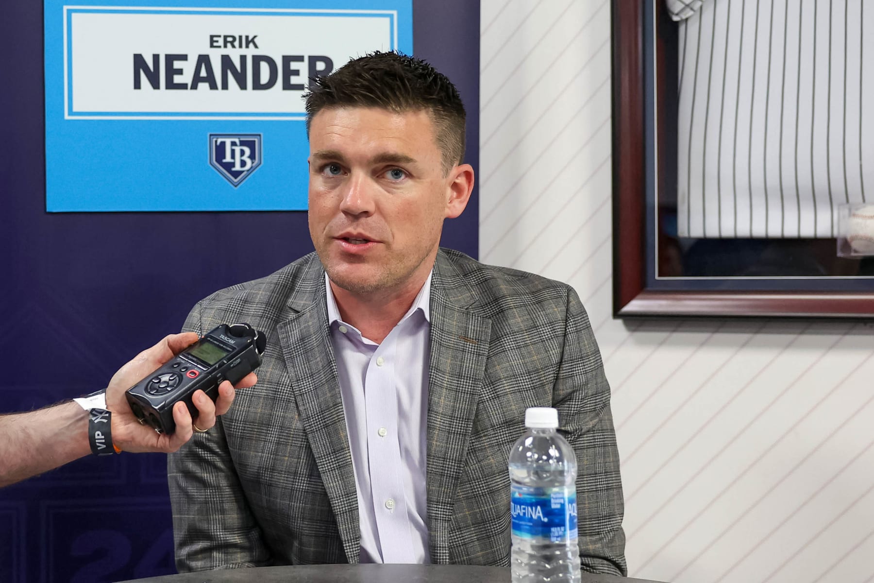 TAMPA, FL - FEBRUARY 15: President of baseball operations Erik Neander of the Tampa Bay Rays talks with a media member during the 2024 Grapefruit League Spring Training Media Day at George M. Steinbrenner Field on Thursday, February 15, 2024 in Tampa, Florida. (Photo by Mike Carlson/MLB Photos via Getty Images)