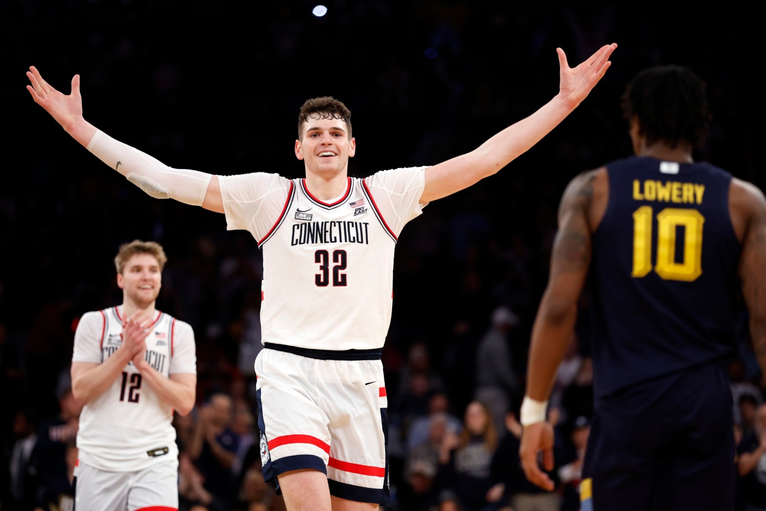 NEW YORK, NEW YORK - MARCH 16: Donovan Clingan #32 of the Connecticut Huskies reacts in the final seconds in the second half against the Marquette Golden Eagles during the Big East Basketball Tournament Final at Madison Square Garden on March 16, 2024 in New York City. The Huskies won 73-57. (Photo by Sarah Stier/Getty Images) NEW YORK, NEW YORK - MARCH 16: Donovan Clingan #32 of the Connecticut Huskies reacts in the final seconds in the second half against the Marquette Golden Eagles during the Big East Basketball Tournament Final at Madison Square Garden on March 16, 2024 in New York City. The Huskies won 73-57. (Photo by Sarah Stier/Getty Images)
