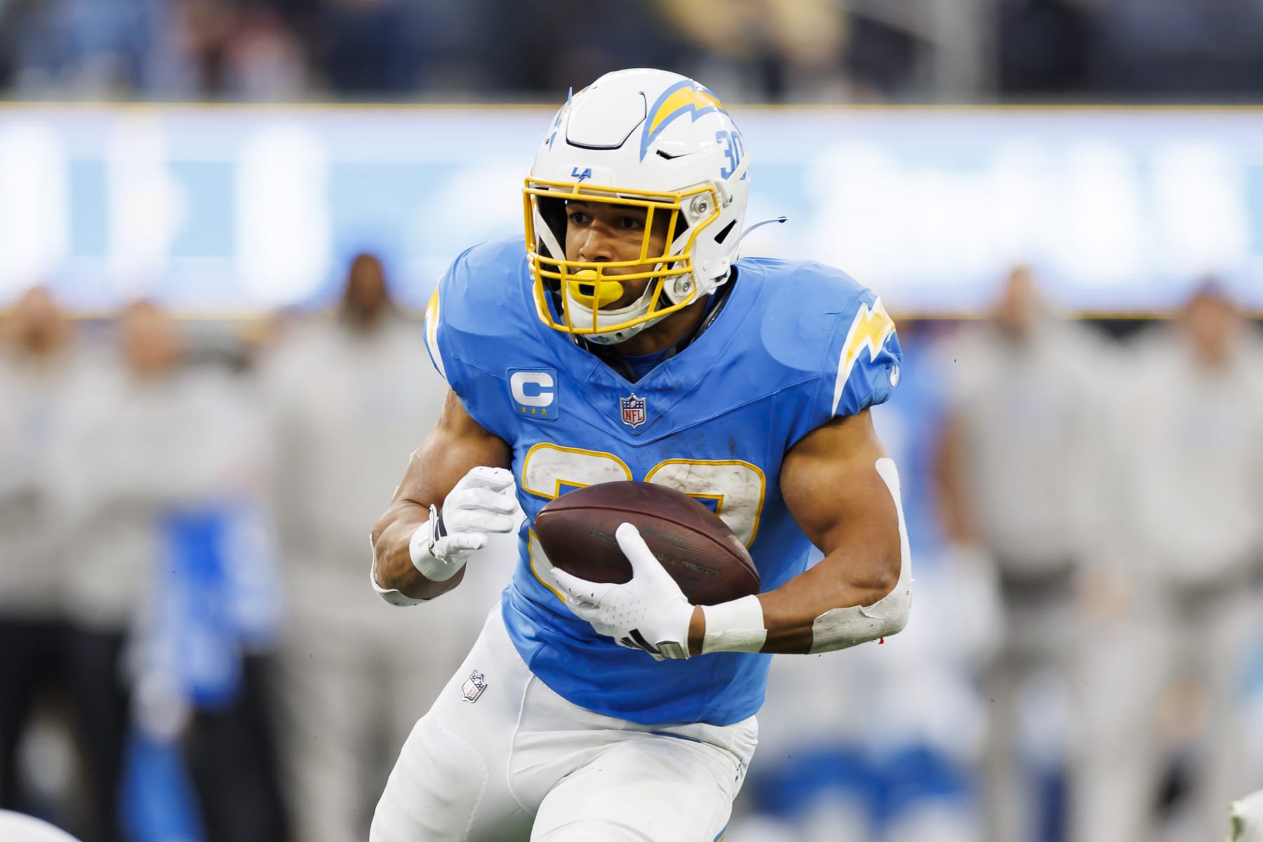 INGLEWOOD, CALIFORNIA - JANUARY 07: Austin Ekeler #30 of the Los Angeles Chargers  carries the ball on a run play during an NFL football game against the Kansas City Chiefs at SoFi Stadium on January 7, 2024 in Inglewood, California. (Photo by Ryan Kang/Getty Images)