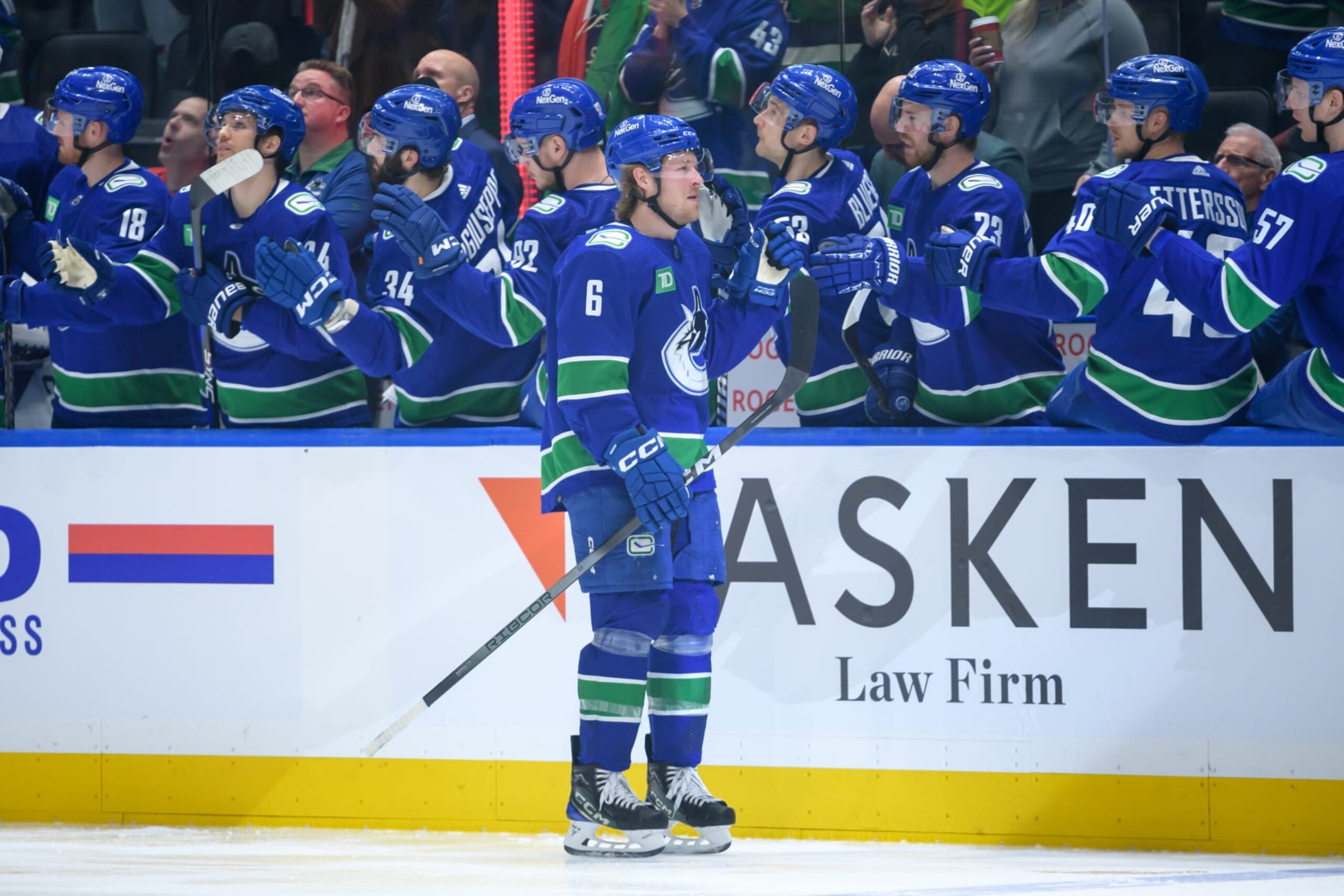 VANCOUVER, CANADA - MARCH 16: Brock Boeser #6 of the Vancouver Canucks is congratulated at the players bench after scoring a goal against the Washington Capitals during the first period of their NHL game at Rogers Arena on March 16, 2024 in Vancouver, British Columbia, Canada. (Photo by Derek Cain/Getty Images)
