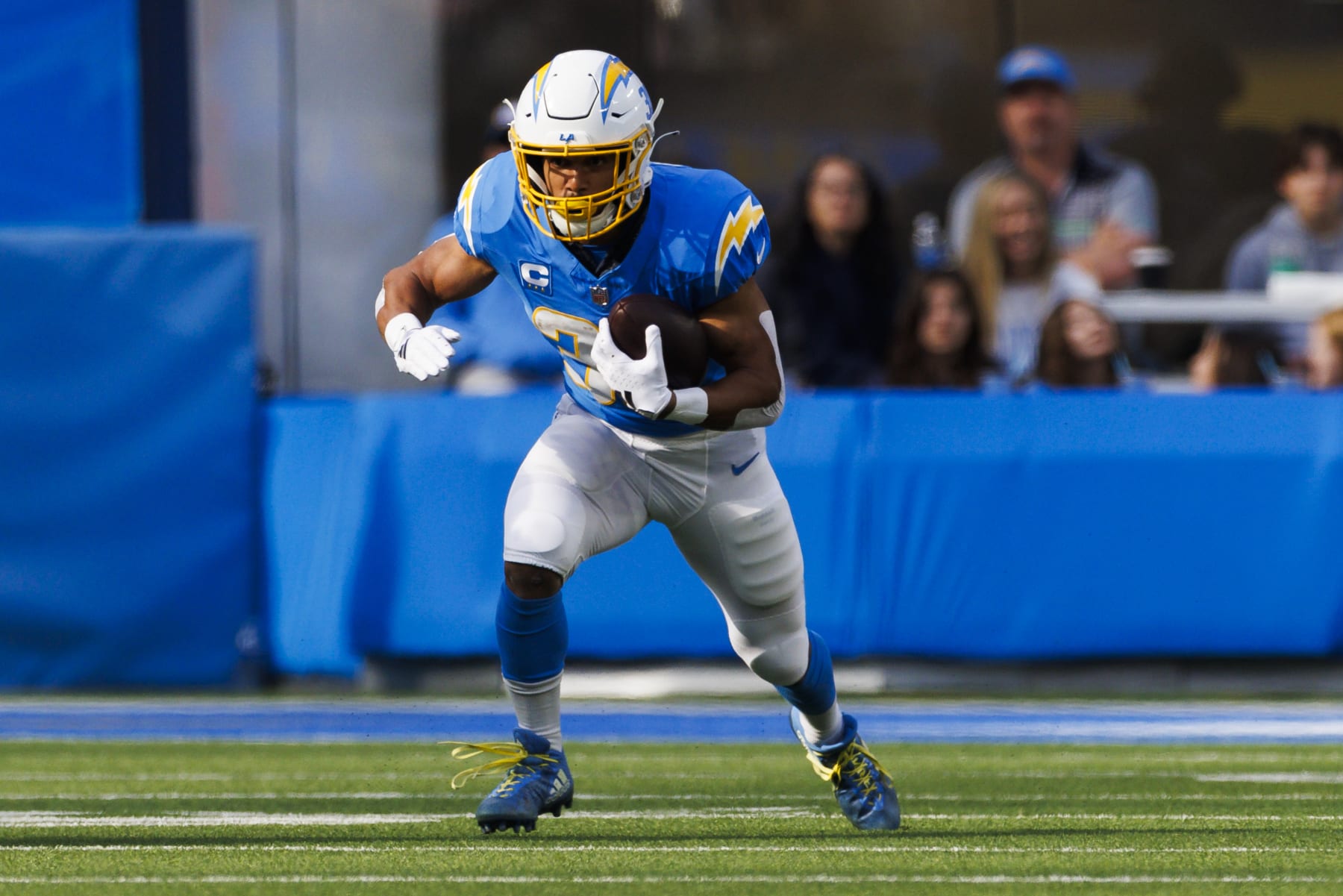 INGLEWOOD, CALIFORNIA - JANUARY 7: Austin Ekeler #30 of the Los Angeles Chargers runs with the ball during a game against the Kansas City Chiefs at SoFi Stadium on January 7, 2024 in Inglewood, California. (Photo by Ric Tapia/Getty Images)
