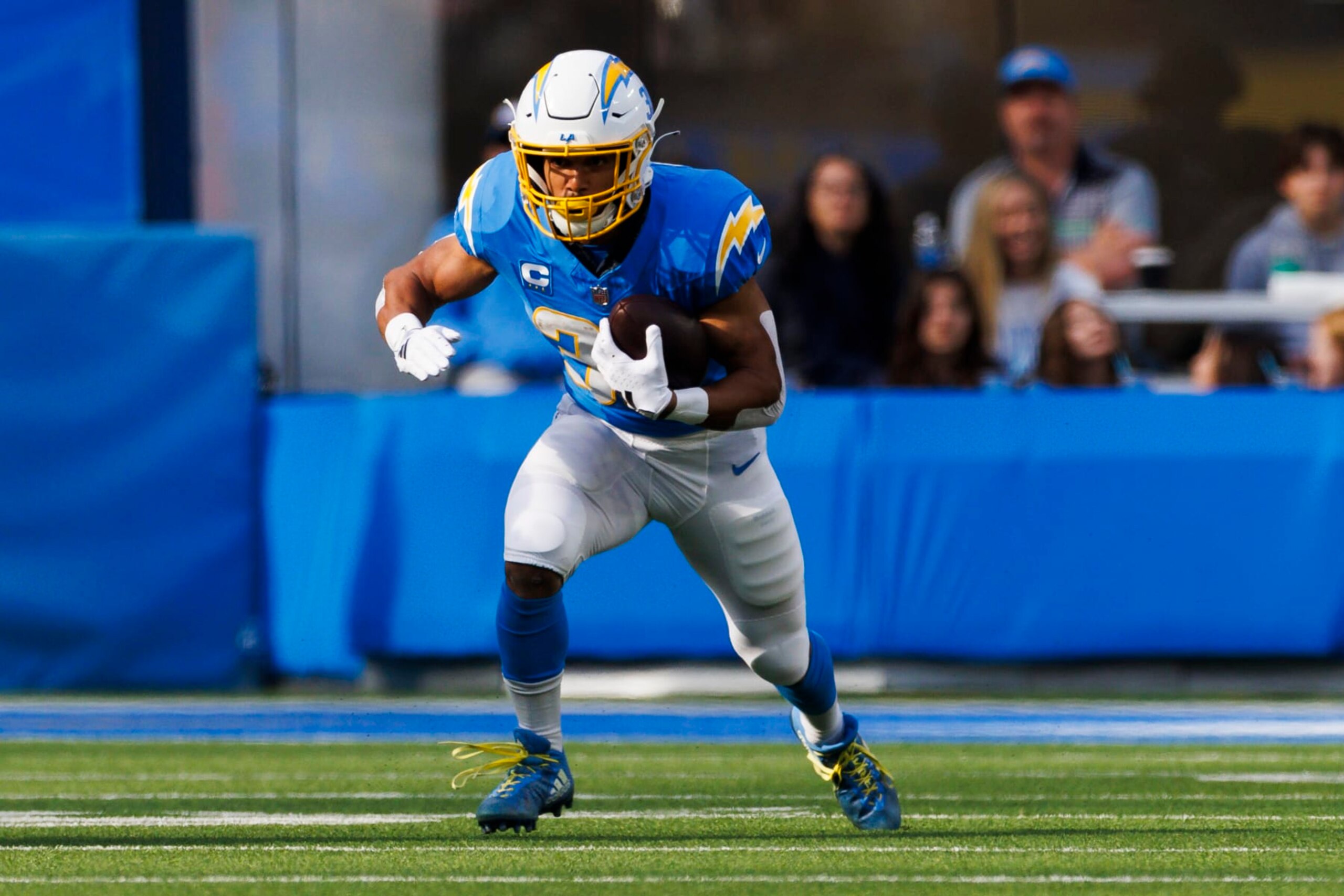 INGLEWOOD, CALIFORNIA - JANUARY 7: Austin Ekeler #30 of the Los Angeles Chargers runs with the ball during a game against the Kansas City Chiefs at SoFi Stadium on January 7, 2024 in Inglewood, California. (Photo by Ric Tapia/Getty Images)