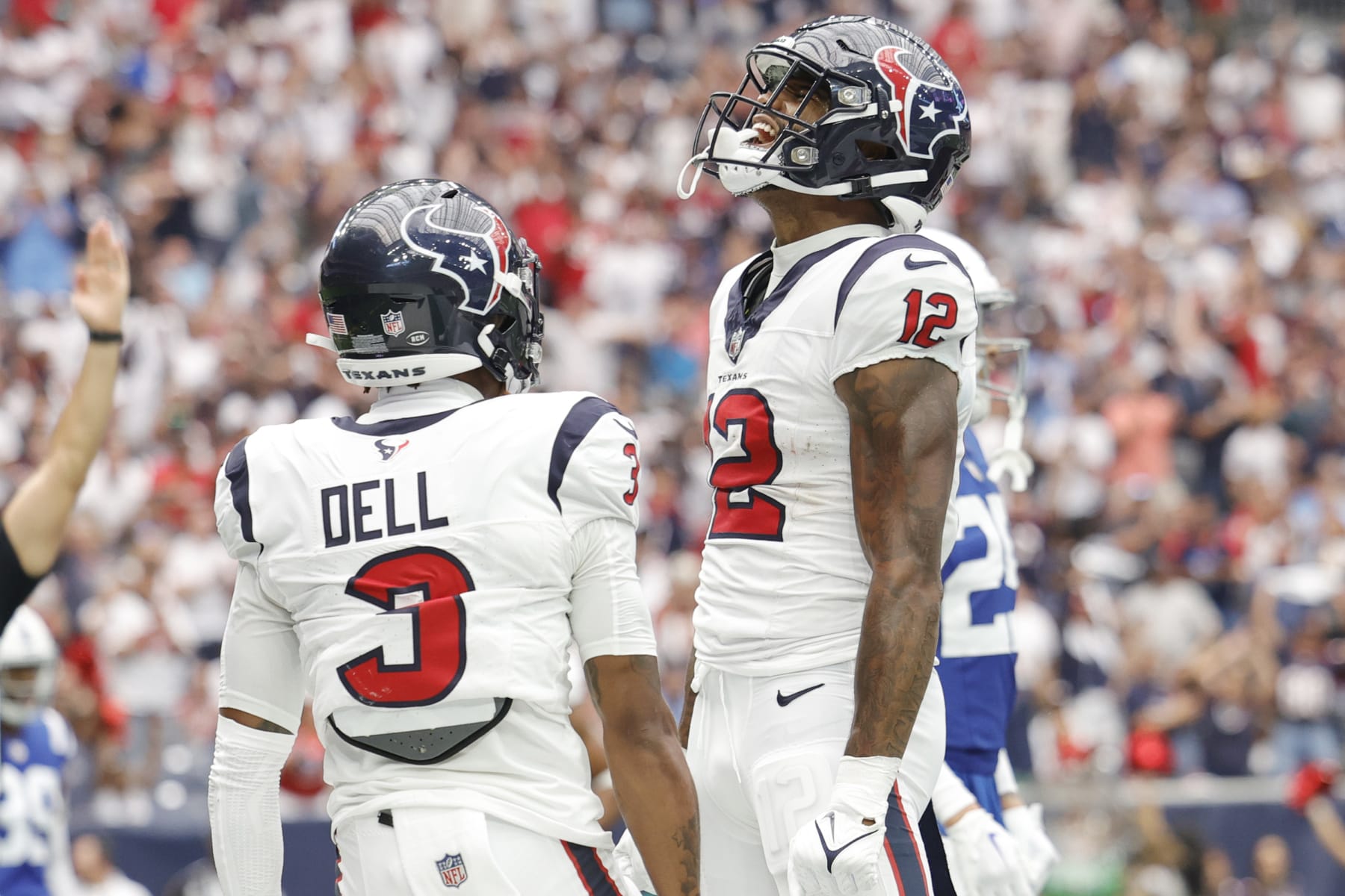 HOUSTON, TEXAS - SEPTEMBER 17: Nico Collins #12 of the Houston Texans celebrates with Tank Dell #3 after scoring a receiving touchdown during the first quarter against the Indianapolis Colts at NRG Stadium on September 17, 2023 in Houston, Texas. (Photo by Carmen Mandato/Getty Images)