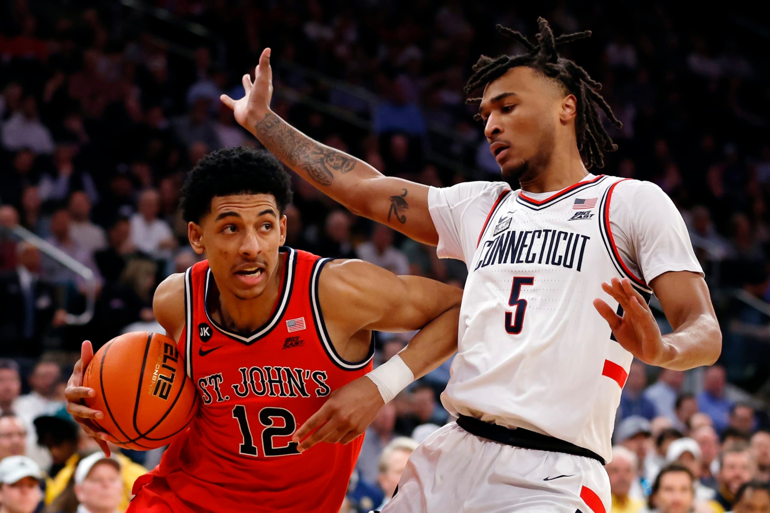NEW YORK, NEW YORK - MARCH 15: Stephon Castle #5 of the Connecticut Huskies guards RJ Luis Jr. #12 of the St. John's Red Storm in the first half during the Semifinal round of the Big East Basketball Tournament at Madison Square Garden on March 15, 2024 in New York City. (Photo by Sarah Stier/Getty Images) NEW YORK, NEW YORK - MARCH 15: Stephon Castle #5 of the Connecticut Huskies guards RJ Luis Jr. #12 of the St. John's Red Storm in the first half during the Semifinal round of the Big East Basketball Tournament at Madison Square Garden on March 15, 2024 in New York City. (Photo by Sarah Stier/Getty Images)