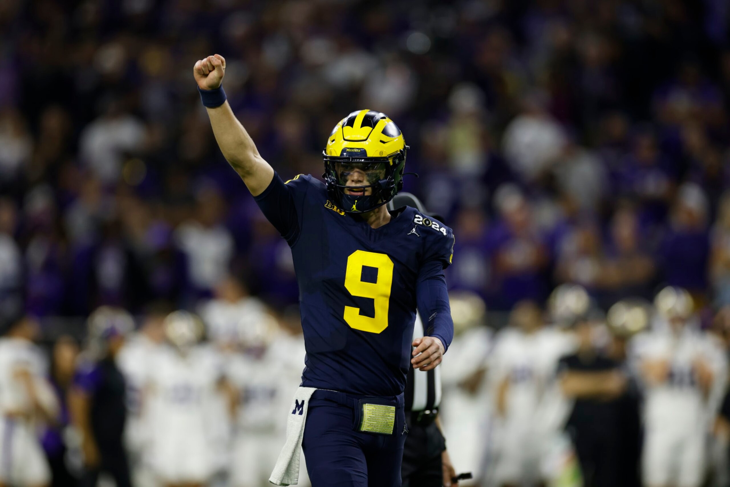 HOUSTON, TX - JANUARY 08: QB J.J. McCarthy (9) of the Michigan Wolverines celebrates after a Michigan touchdown in the fourth quarter during the Michigan Wolverines versus the Washington Huskies CFP National Championship game on January 8, 2024, at NRG Stadium in Houston, TX. (Photo by Joe Robbins/Icon Sportswire via Getty Images) HOUSTON, TX - JANUARY 08: QB J.J. McCarthy (9) of the Michigan Wolverines celebrates after a Michigan touchdown in the fourth quarter during the Michigan Wolverines versus the Washington Huskies CFP National Championship game on January 8, 2024, at NRG Stadium in Houston, TX. (Photo by Joe Robbins/Icon Sportswire via Getty Images)