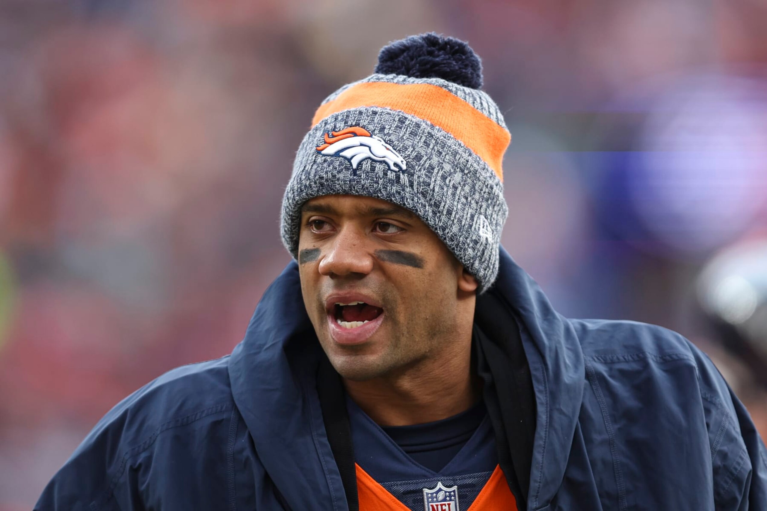DENVER, CO - DECEMBER 31: Russell Wilson #3 of the Denver Broncos looks on from the sideline during an NFL football game against the Los Angeles Chargers at Empower Field at Mile High on December 31, 2023 in Denver, Colorado. (Photo by Perry Knotts/Getty Images)