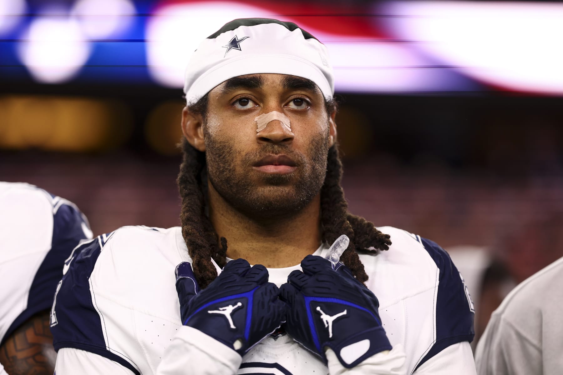 ARLINGTON, TX - DECEMBER 10: Stephon Gilmore #21 of the Dallas Cowboys stands on the sidelines during the national anthem prior to an NFL football game against the Philadelphia Eagles at AT&T Stadium on December 10, 2023 in Arlington, Texas. (Photo by Kevin Sabitus/Getty Images)