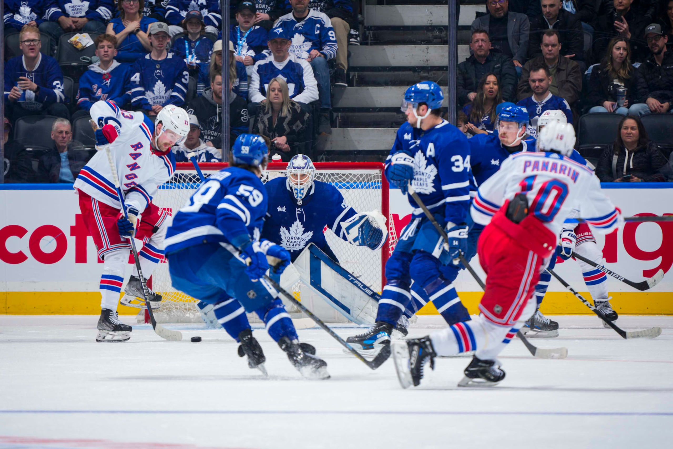 TORONTO, ON - MARCH 2: Ilya Samsonov #35 of the Toronto Maple Leafs defends the net against Alexis Lafreniere #13 of the New York Rangers during the third period at Scotiabank Arena on March 2, 2024 in Toronto, Ontario, Canada. (Photo by Mark Blinch/NHLI via Getty Images)