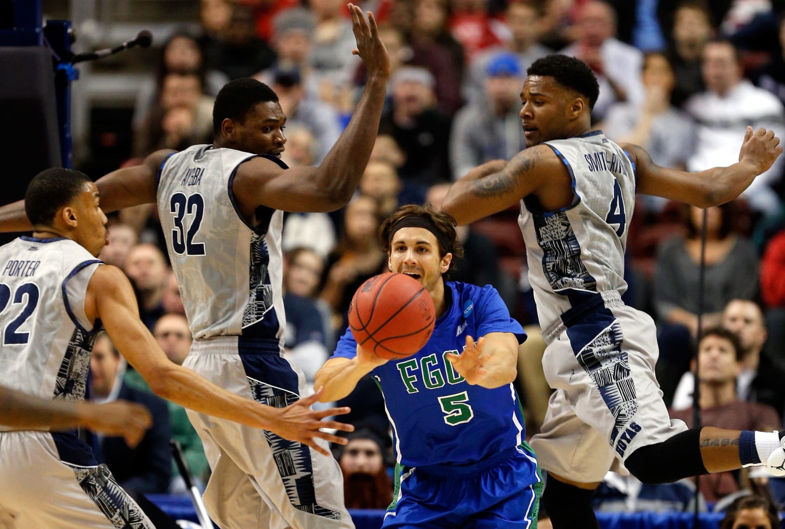 PHILADELPHIA, PA - MARCH 22: Christophe Varidel #5 of the Florida Gulf Coast Eagles passes the ball in the first half against Otto Porter Jr. #22, Moses Ayegba #32 and D'Vauntes Smith-Rivera #4 of the Georgetown Hoyas during the second round of the 2013 NCAA Men's Basketball Tournament at Wells Fargo Center on March 22, 2013 in Philadelphia, Pennsylvania. (Photo by Rob Carr/Getty Images) PHILADELPHIA, PA - MARCH 22: Christophe Varidel #5 of the Florida Gulf Coast Eagles passes the ball in the first half against Otto Porter Jr. #22, Moses Ayegba #32 and D'Vauntes Smith-Rivera #4 of the Georgetown Hoyas during the second round of the 2013 NCAA Men's Basketball Tournament at Wells Fargo Center on March 22, 2013 in Philadelphia, Pennsylvania. (Photo by Rob Carr/Getty Images)