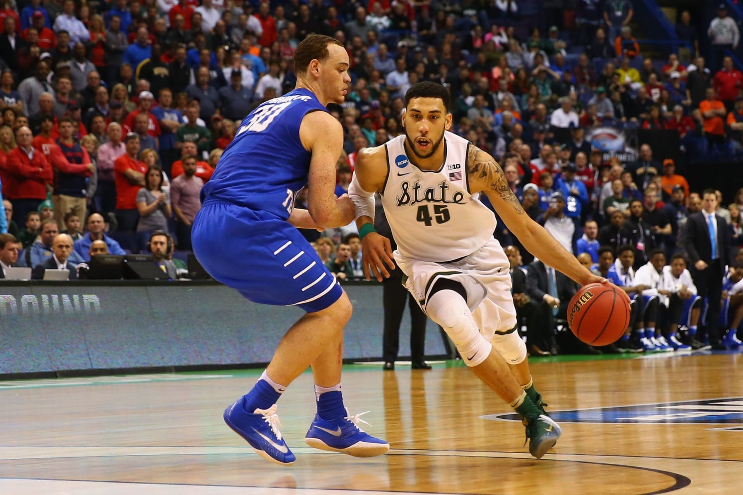 ST. LOUIS, MO - MARCH 18: Denzel Valentine #45 of the Michigan State Spartans drives to the basket against Reggie Upshaw Jr #30 of the Middle Tennessee Blue Raiders during the first round of the NCAA Basketball Tournament at the Scottrade center on March 18, 2016 in St. Louis, Missouri. (Photo by Dilip Vishwanat/Getty Images) ST. LOUIS, MO - MARCH 18: Denzel Valentine #45 of the Michigan State Spartans drives to the basket against Reggie Upshaw Jr #30 of the Middle Tennessee Blue Raiders during the first round of the NCAA Basketball Tournament at the Scottrade center on March 18, 2016 in St. Louis, Missouri. (Photo by Dilip Vishwanat/Getty Images)
