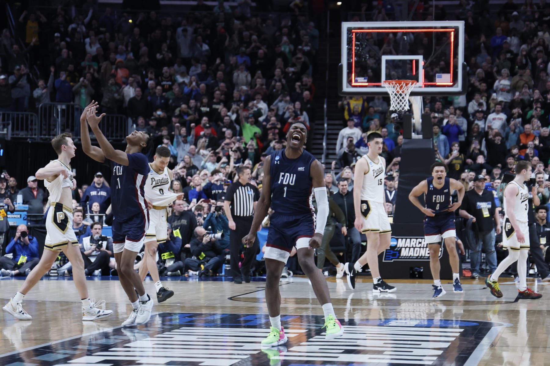 COLUMBUS, OH - MARCH 17: Players from the Fairleigh Dickinson Knights celebrate their win over the Purdue Boilermakers in the first round of the 2023 NCAA Men's Basketball Tournament held at Nationwide Arena on March 17, 2023 in Columbus, Ohio. (Photo by Jay LaPrete/NCAA Photos via Getty Images)