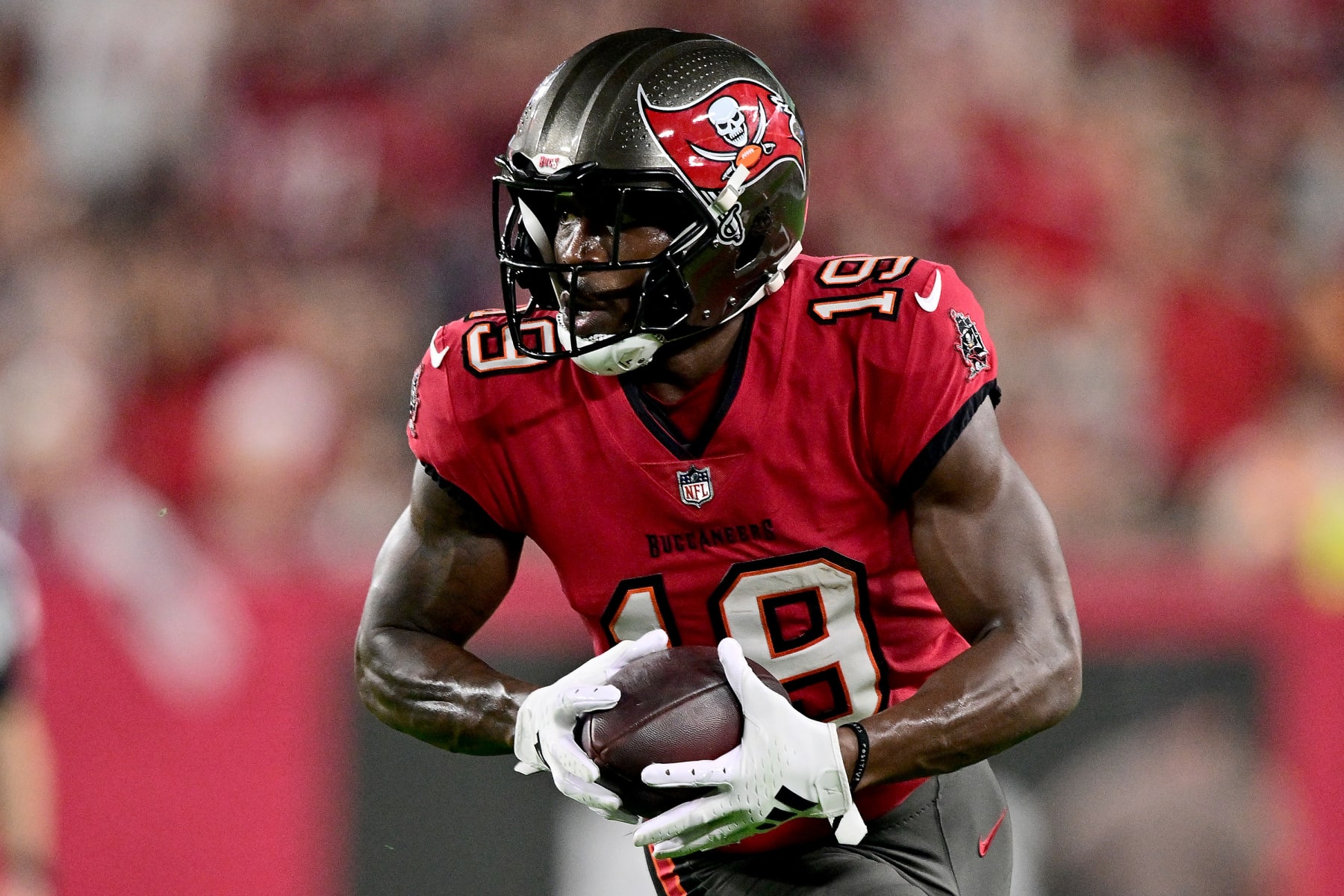 TAMPA, FLORIDA - JANUARY 15: David Moore #19 of the Tampa Bay Buccaneers runs with the ball to score a 44 yard touchdown against the Philadelphia Eagles during the first quarter in the NFC Wild Card Playoffs at Raymond James Stadium on January 15, 2024 in Tampa, Florida. (Photo by Julio Aguilar/Getty Images) TAMPA, FLORIDA - JANUARY 15: David Moore #19 of the Tampa Bay Buccaneers runs with the ball to score a 44 yard touchdown against the Philadelphia Eagles during the first quarter in the NFC Wild Card Playoffs at Raymond James Stadium on January 15, 2024 in Tampa, Florida. (Photo by Julio Aguilar/Getty Images)
