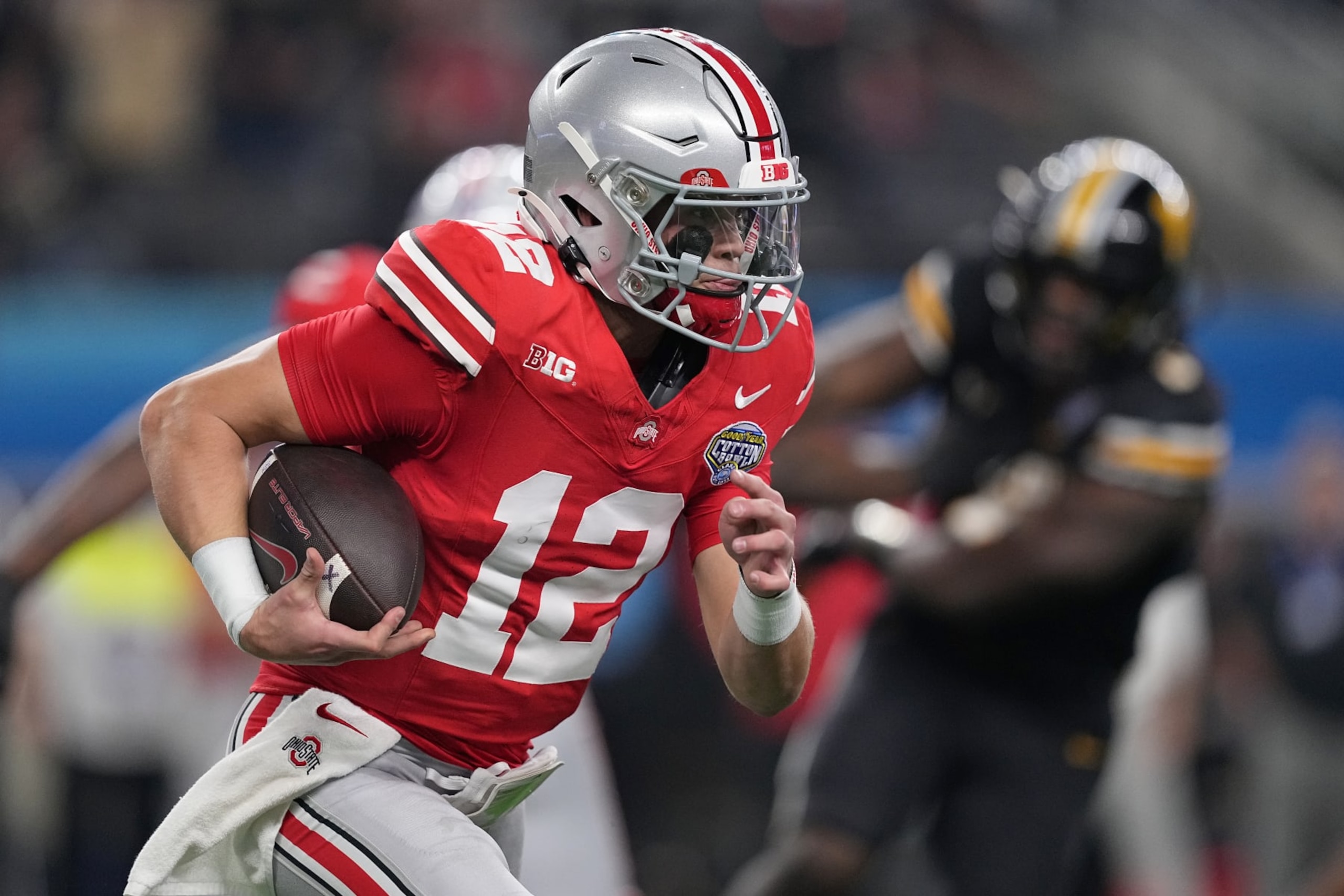 ARLINGTON, TEXAS - DECEMBER 29: Lincoln Kienholz #12 of the Ohio State Buckeyes runs the ball during the second quarter against the Missouri Tigers in the Goodyear Cotton Bowl at AT&T Stadium on December 29, 2023 in Arlington, Texas. (Photo by Sam Hodde/Getty Images) ARLINGTON, TEXAS - DECEMBER 29: Lincoln Kienholz #12 of the Ohio State Buckeyes runs the ball during the second quarter against the Missouri Tigers in the Goodyear Cotton Bowl at AT&T Stadium on December 29, 2023 in Arlington, Texas. (Photo by Sam Hodde/Getty Images)