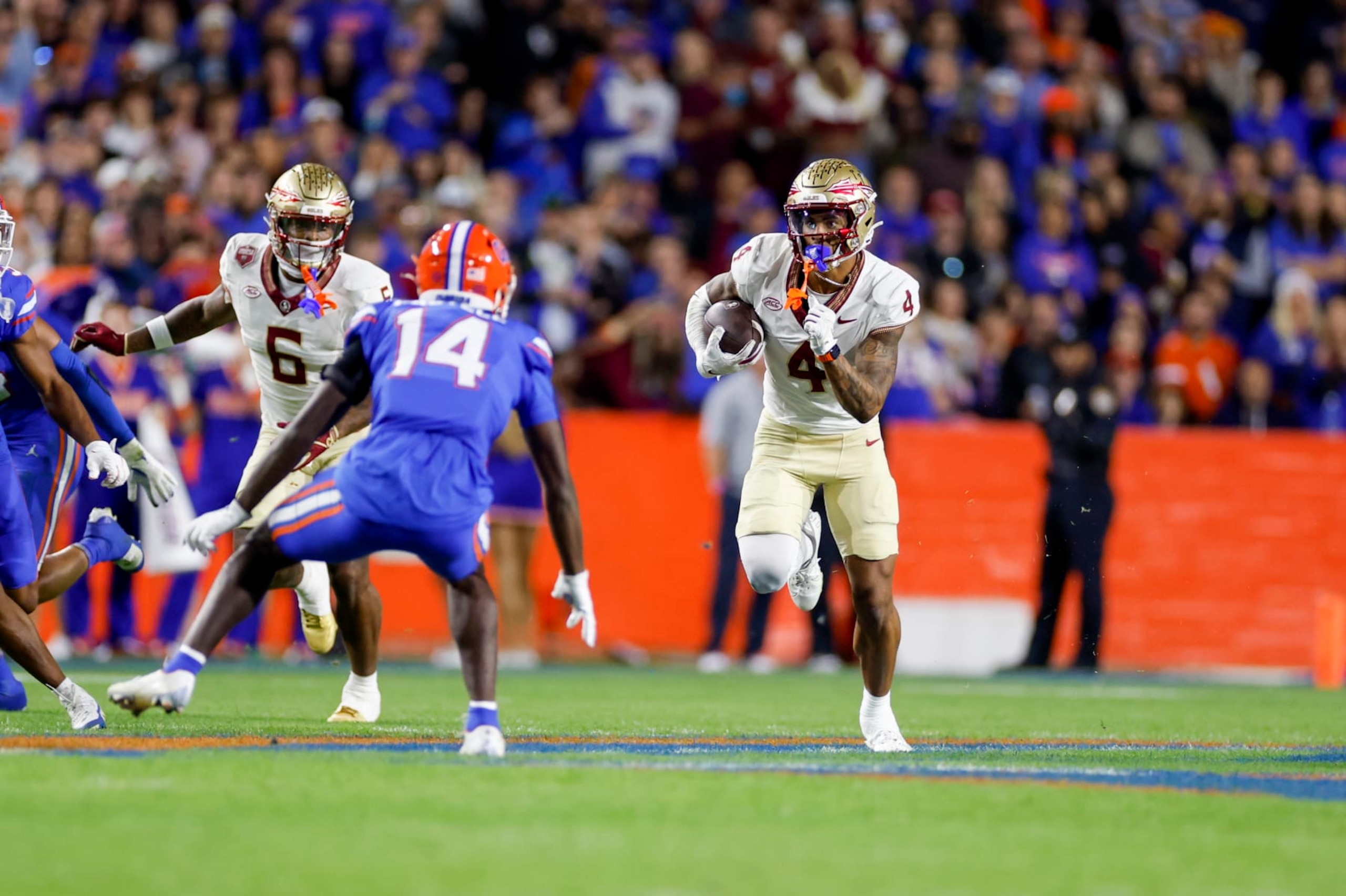 GAINESVILLE, FL - NOVEMBER 25: Florida State Seminoles wide receiver Keon Coleman (4) runs with the ball during the game between the Florida Gators and the Florida State Seminoles on November 25, 2023 at Ben Hill Griffin Stadium at Florida Field in Gainesville, Fl. (Photo by David Rosenblum/Icon Sportswire via Getty Images) GAINESVILLE, FL - NOVEMBER 25: Florida State Seminoles wide receiver Keon Coleman (4) runs with the ball during the game between the Florida Gators and the Florida State Seminoles on November 25, 2023 at Ben Hill Griffin Stadium at Florida Field in Gainesville, Fl. (Photo by David Rosenblum/Icon Sportswire via Getty Images)