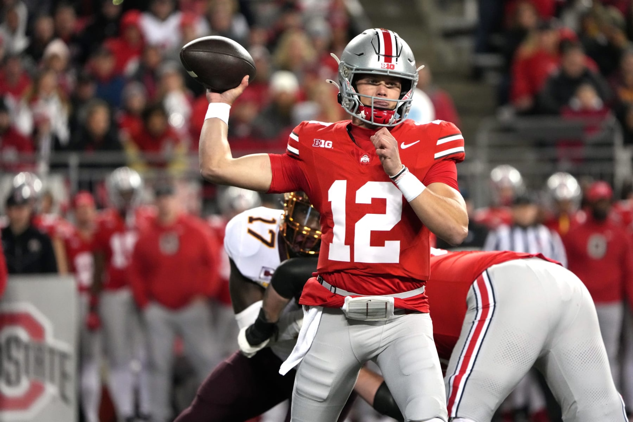 COLUMBUS, OHIO - NOVEMBER 18: Quarterback Lincoln Kienholz #12 of the Ohio State Buckeyes looks to pass the ball during the game against the Minnesota Golden Gophers at Ohio Stadium on November 18, 2023 in Columbus, Ohio. (Photo by Jason Mowry/Getty Images) COLUMBUS, OHIO - NOVEMBER 18: Quarterback Lincoln Kienholz #12 of the Ohio State Buckeyes looks to pass the ball during the game against the Minnesota Golden Gophers at Ohio Stadium on November 18, 2023 in Columbus, Ohio. (Photo by Jason Mowry/Getty Images)