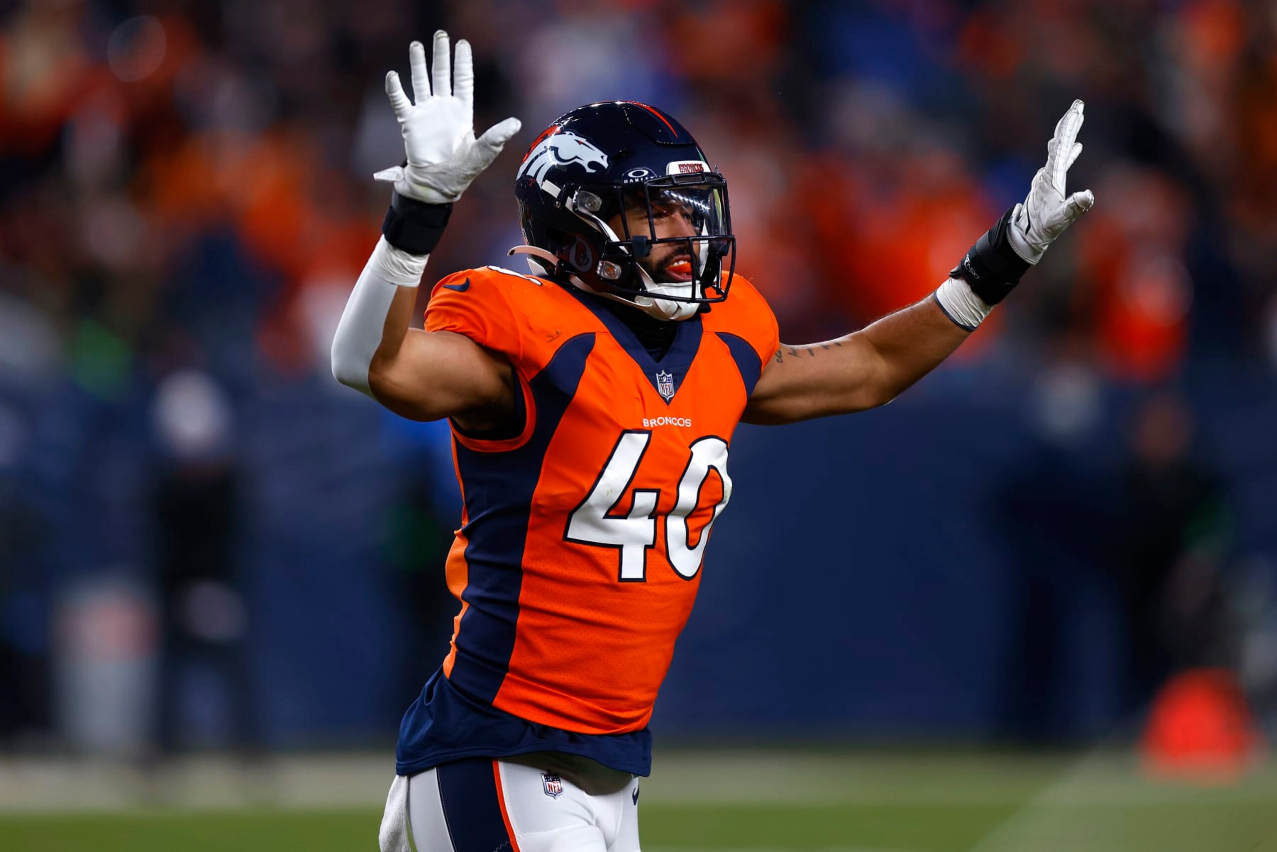 DENVER, COLORADO - DECEMBER 31: Justin Strnad #40 of the Denver Broncos celebrates after missed field goal by the Los Angeles Chargers during the fourth quarter at Empower Field At Mile High on December 31, 2023 in Denver, Colorado. (Photo by Justin Edmonds/Getty Images)