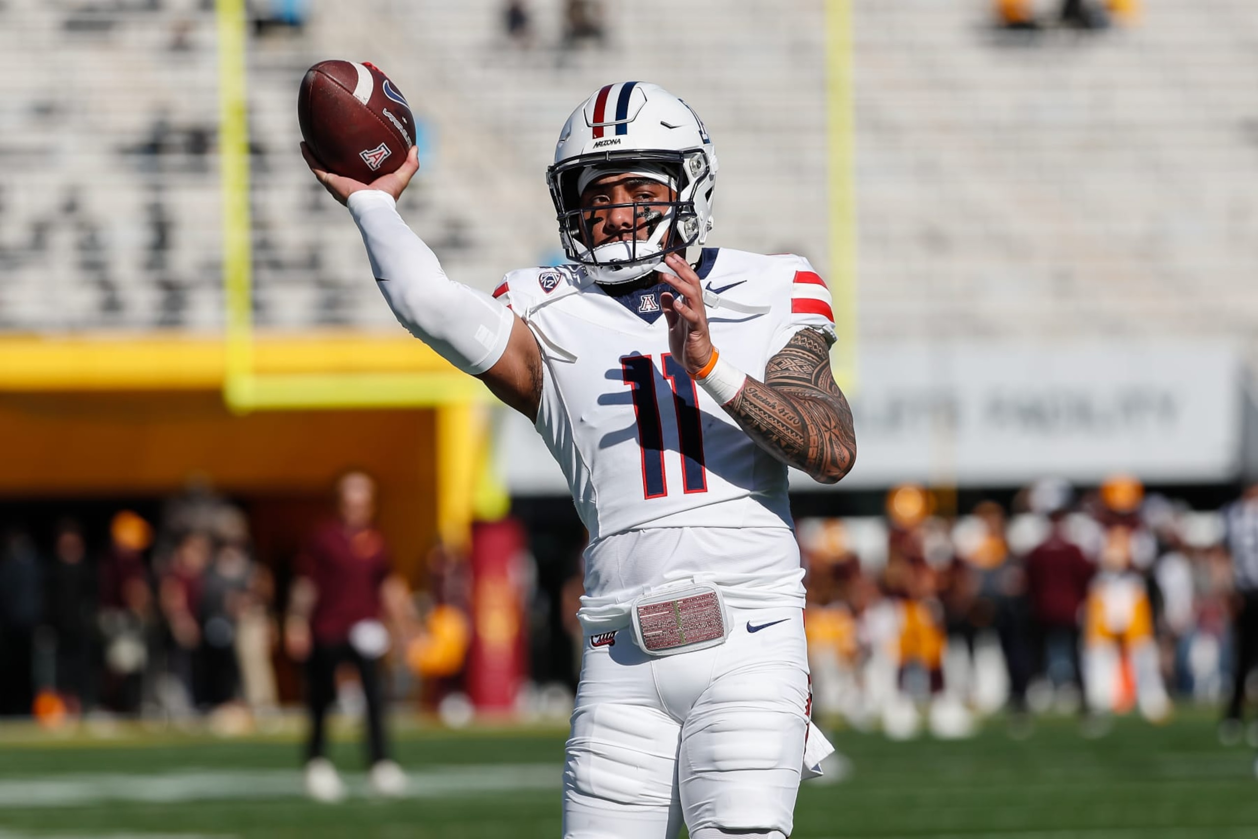 TEMPE, AZ - NOVEMBER 25: Arizona Wildcats quarterback Noah Fifita (11) warms up before the college football game between the Arizona Wildcats and the Arizona State Sun Devils on November 25, 2023 at Mountain America Stadium in Tempe, Arizona. (Photo by Kevin Abele/Icon Sportswire via Getty Images) TEMPE, AZ - NOVEMBER 25: Arizona Wildcats quarterback Noah Fifita (11) warms up before the college football game between the Arizona Wildcats and the Arizona State Sun Devils on November 25, 2023 at Mountain America Stadium in Tempe, Arizona. (Photo by Kevin Abele/Icon Sportswire via Getty Images)